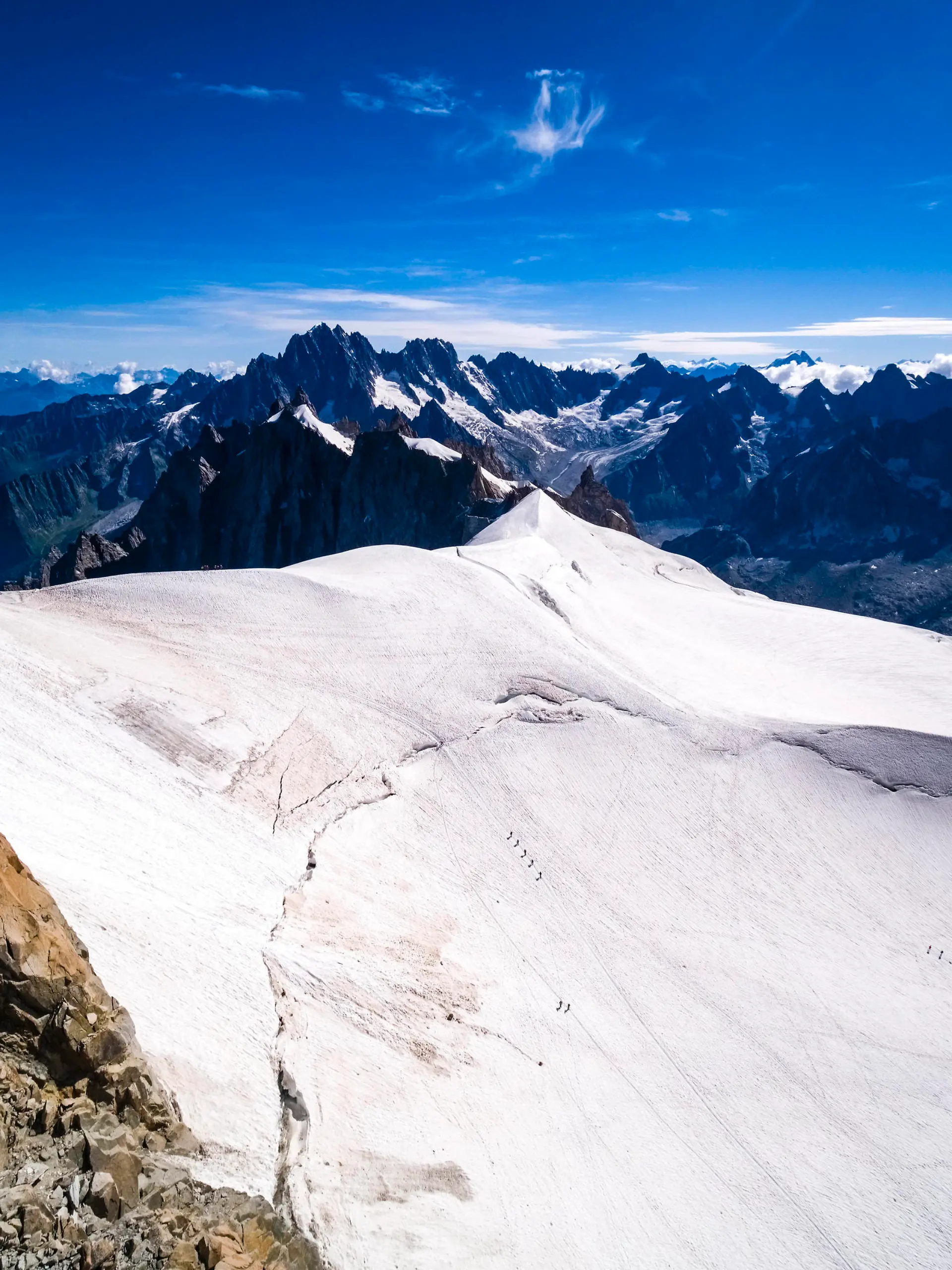 Aerial view from the Panoramic Mont Blanc cable car between Aiguille du Midi and Pointe Helbronner of the GÃ ant Glacier, alpinists crossing the ice. Chamonix Haute-Savoie France FB_2022_2157