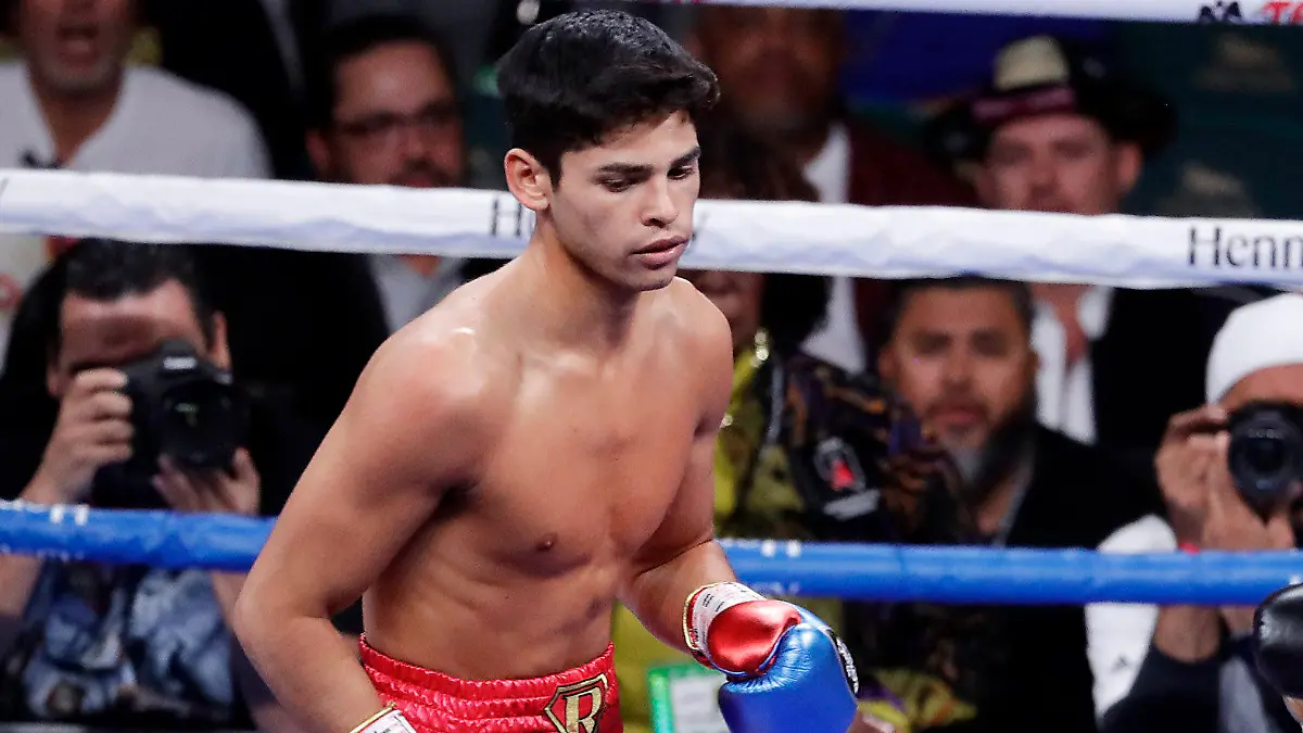 FILE - In this Nov. 2, 2019 file photo, Ryan Garcia, looks on after landing a punch to Romero Duno (not seen) during their lightweight boxing match in Las Vegas.   Garcia meets Britain’s Luke Campbell, a 2012 Olympic champion, in an interim WBC lightweight title fight. The bout was postponed a month and moved from California after Campbell tested positive for COVID-19.(AP Photo/Isaac Brekken, File)