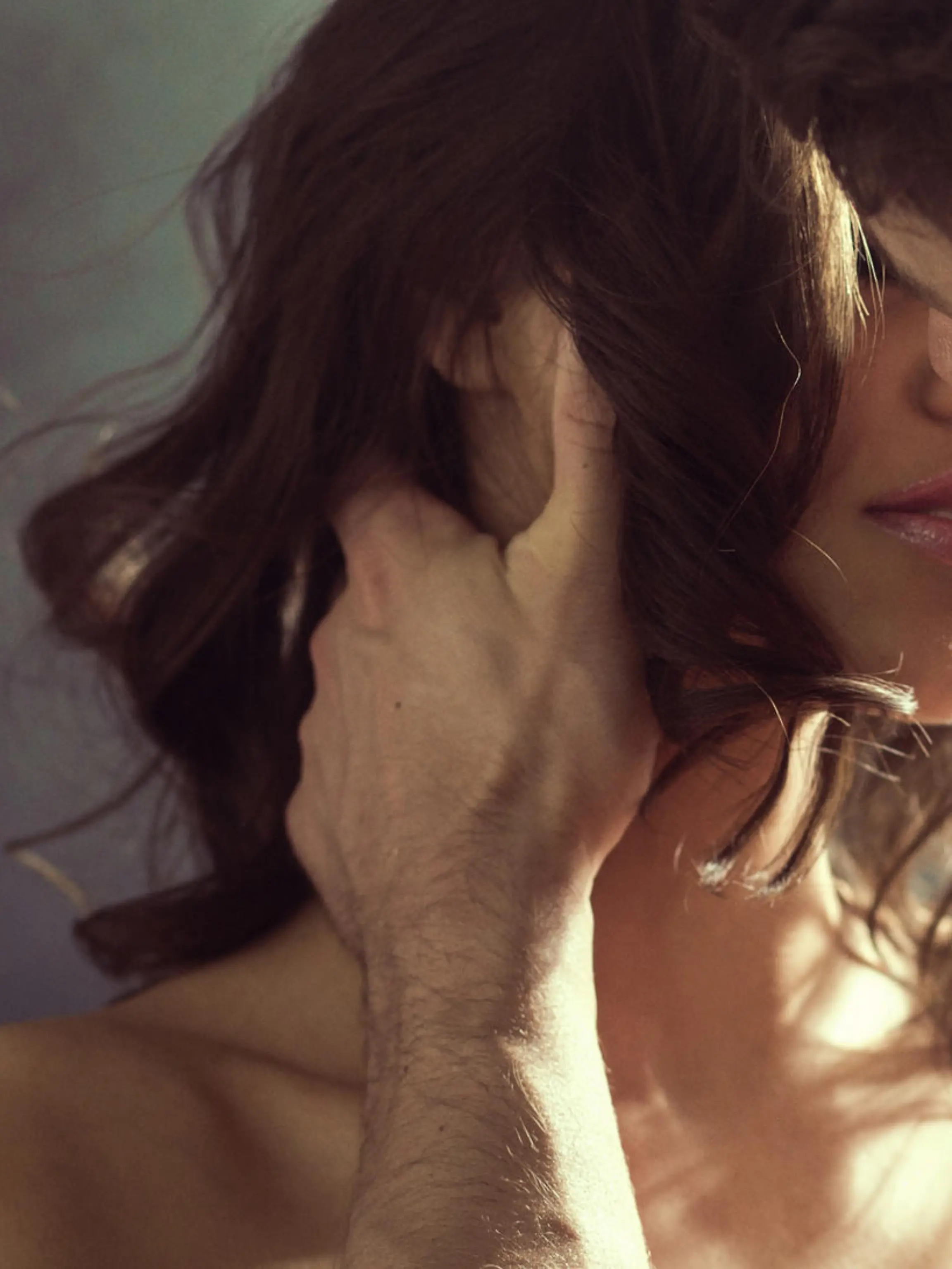 Sensual woman kissing her handsome husband