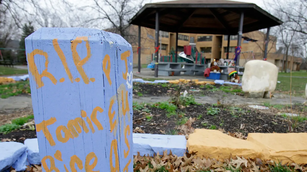 FILE – In this Dec. 29, 2015, file photo, "R.I.P. Tamir Rice" is written on a wooden post near a makeshift memorial at the gazebo where the boy was fatally shot, outside the Cudell Recreation Center in Cleveland. The Justice Department announced Tuesday, Dec. 29, 2020, that it would not bring federal criminal charges against two Cleveland police officers in the 2014 killing of 12-year-old Tamir Rice, saying video of the shooting was of too poor a quality for prosecutors to conclusively establish what had happened (AP Photo/Tony Dejak, File)