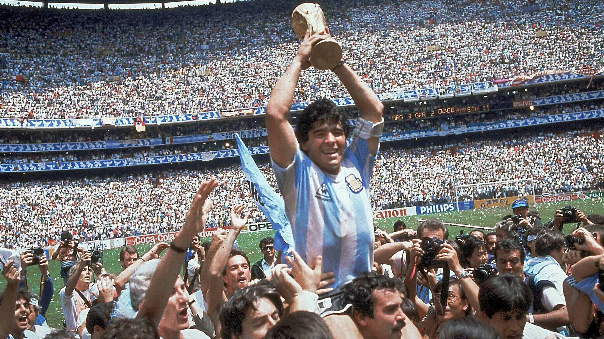 FILE - In this June 29, 1986, file photo, Diego Maradona holds up his team's trophy after Argentina's 3-2 victory over West Germany at the World Cup final soccer match at Azteca Stadium in Mexico City. The Argentine soccer great who was among the best players ever and who led his country to the 1986 World Cup title died from a heart attack on Wednesday, Nov. 25, 2020, at his home in Buenos Aires. He was 60. (AP Photo/Carlo Fumagalli, File)