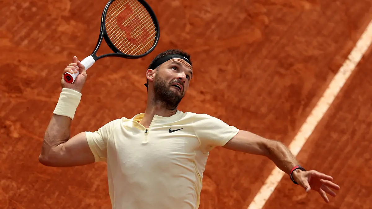 MONTE-CARLO, MONACO - APRIL 11: Grigor Dimitrov of Bulgaria serves against Ben Shelton of the United States in their first round match during day three of the Rolex Monte-Carlo Masters at Monte-Carlo Country Club on April 11, 2023 in Monte-Carlo, Monaco. (Photo by Clive Brunskill/Getty Images)