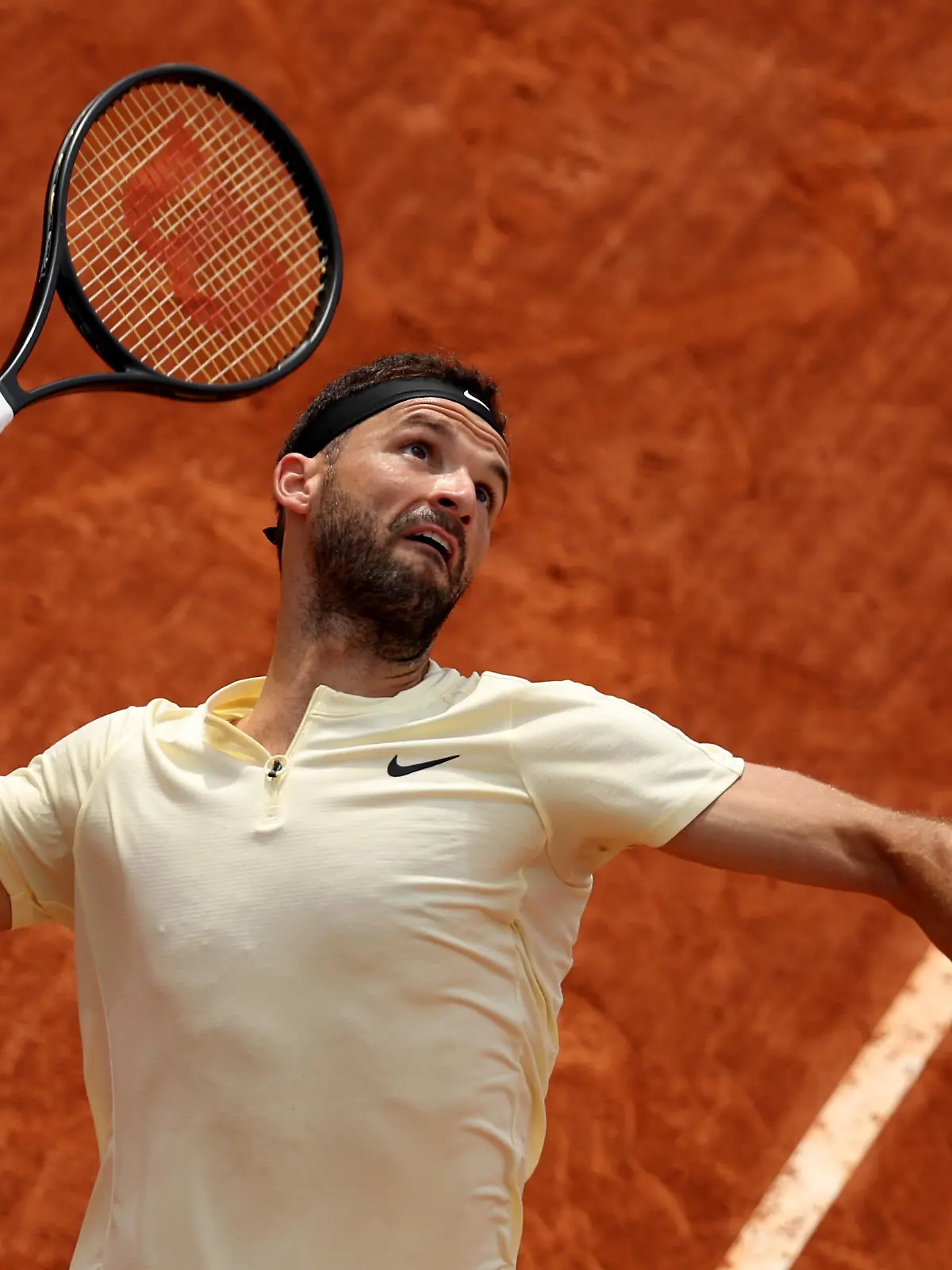 MONTE-CARLO, MONACO - APRIL 11: Grigor Dimitrov of Bulgaria serves against Ben Shelton of the United States in their first round match during day three of the Rolex Monte-Carlo Masters at Monte-Carlo Country Club on April 11, 2023 in Monte-Carlo, Monaco. (Photo by Clive Brunskill/Getty Images)