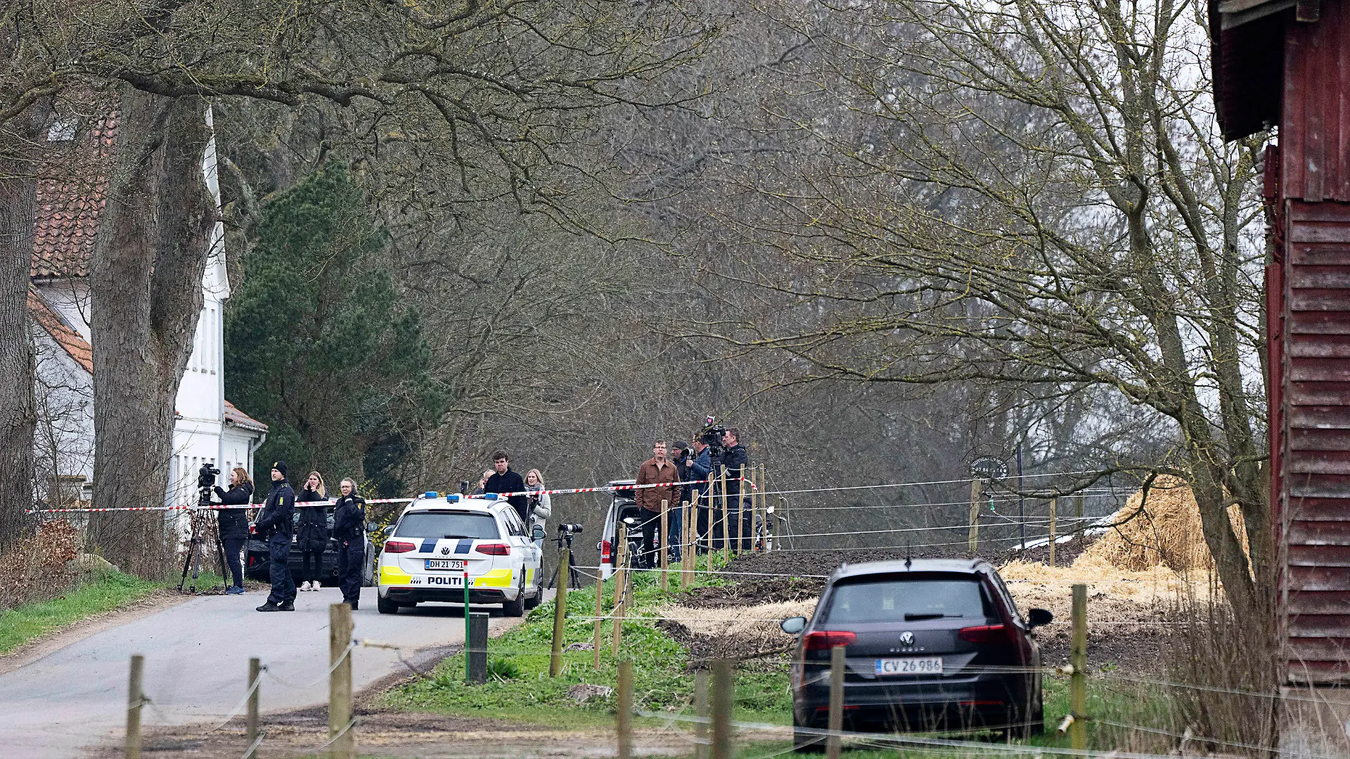 Police inspect the area by a house in connection with the search effort for a missing 13-yr-old girl, around Kirkerup, south of Slagelse, Denmark, Sunday, April 16, 2023. Police and others are looking for 13-year-old Filippa, who was reported missing on Saturday. (Claus Bech/Ritzau Scanpix via AP)