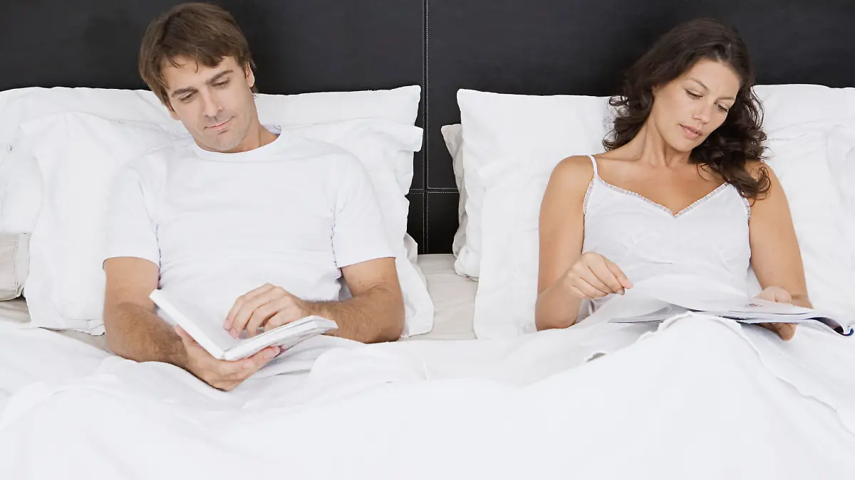 Couple reading in bed