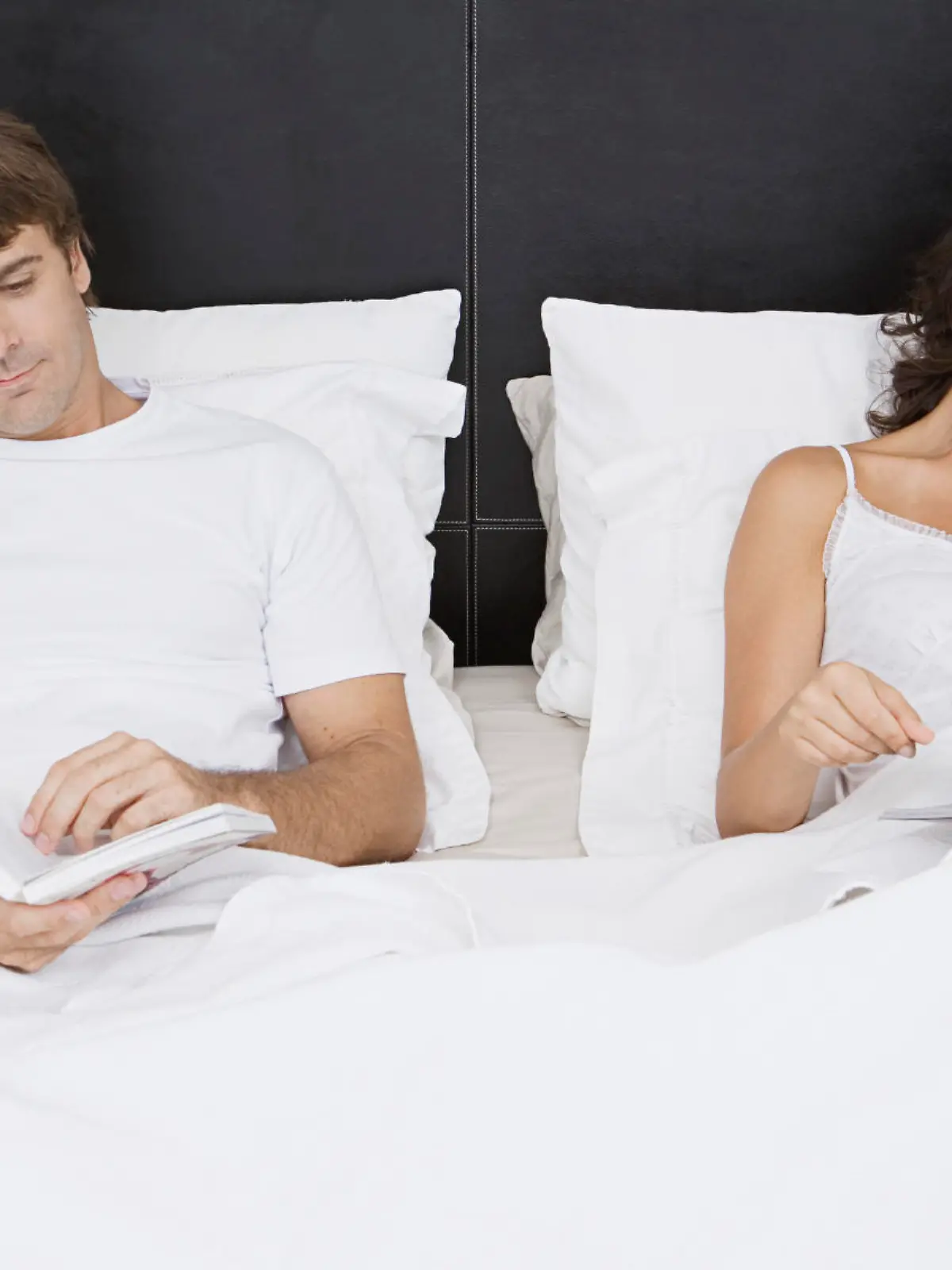 Couple reading in bed