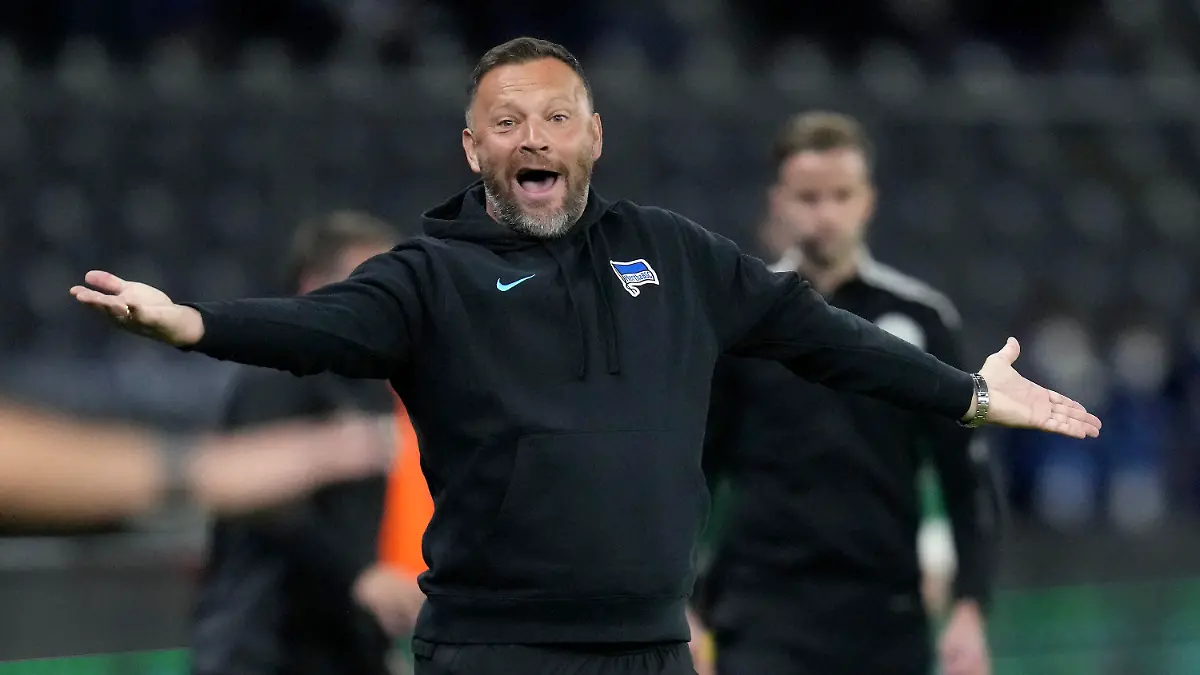 FILE - Berlin's head coach Pal Dardai shouts during the German Bundesliga soccer match between Hertha BSC Berlin and SpVgg Greuther Fuerth in Berlin, Germany, Friday, Sept. 17, 2021. Hertha Berlin is bringing Pal Dardai back for a third stint as coach after firing Sandro Schwarz on Sunday in a bid to escape relegation. The Bundesliga club said the 47-year-old Dardai will take over for the rest of season.    (AP Photo/Michael Sohn, File)