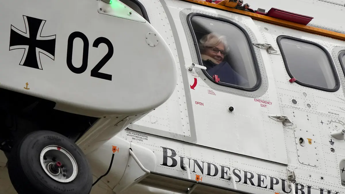German Defence Minister Christine Lambrecht sits in a helicopter as she arrives for the presentation of the Marder armored personnel carrier at the 'Erzgebirgskaserne' barracks in Marienberg, eastern Germany, Thursday, Jan. 12, 2023. The German government says Berlin aims to supply around 40 Marder armored personnel carriers to Ukraine in this year's first quarter. (AP Photo/Michael Sohn)