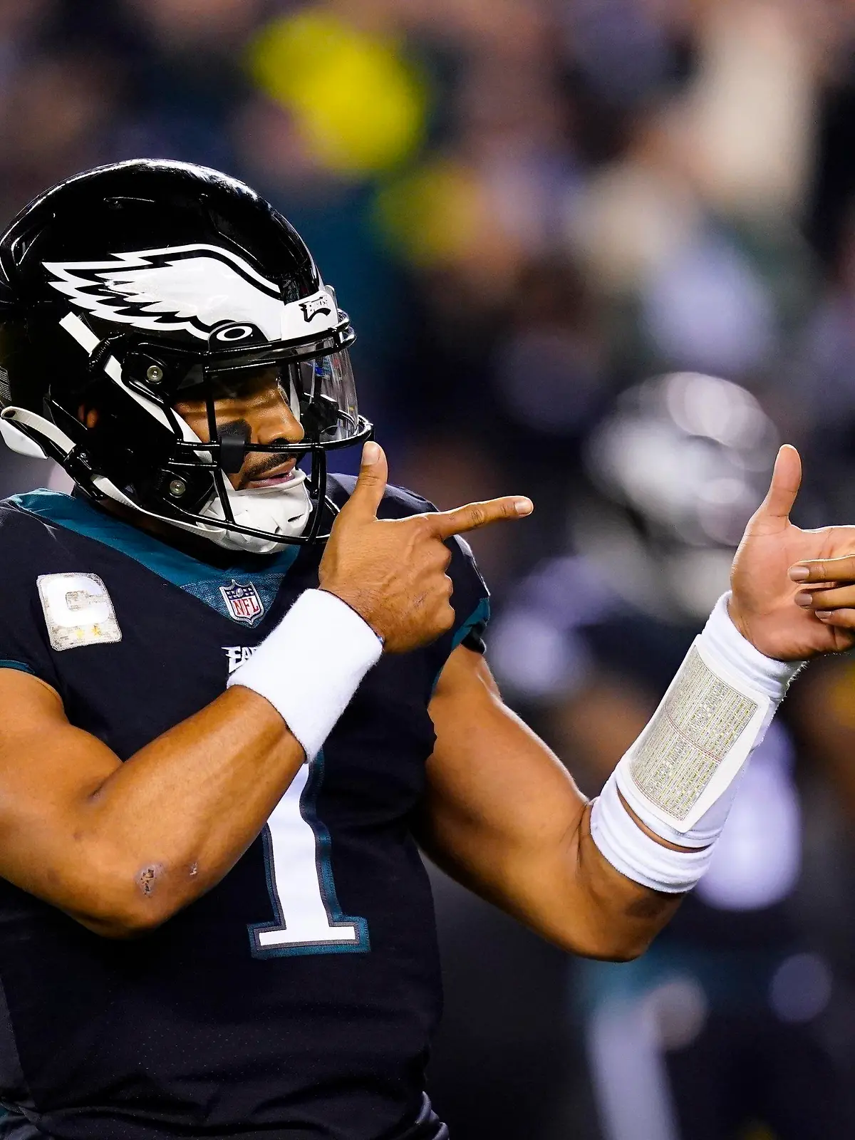 FILE — Philadelphia Eagles quarterback Jalen Hurts celebrates a touchdown run by Kenneth Gainwell during the first half of the team's NFL football game against the Green Bay Packers on Nov. 27, 2022, in Philadelphia. Jalen Hurts is set to sign one of the richest deals in NFL history, agreeing to a five-year, $255 million extension with the Philadelphia Eagles, including $179.3 million guaranteed, a person with knowledge of the situation told The Associated Press. The Eagles announced on Monday, April 17,  “QB1 is here to stay,” but terms were not yet announced, according to the person who spoke to the AP on condition of anonymity because the deal was not yet final. (AP Photo/Chris Szagola, File)