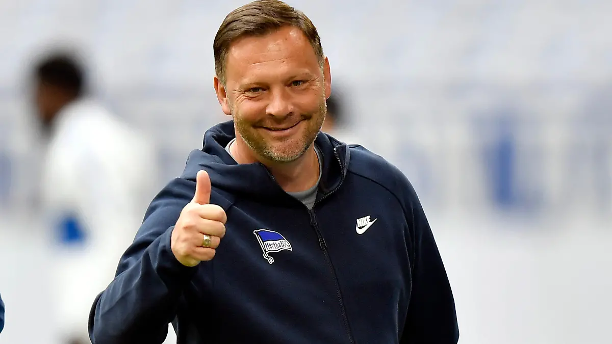 FILE - Berlin's head coach Pal Dardai gestures before the German Bundesliga soccer match between Hertha BSC Berlin and FC Schalke 04 in Gelsenkirchen, Germany, Wednesday, May 12, 2021. Hertha Berlin is bringing Pal Dardai back for a third stint as coach after firing Sandro Schwarz on Sunday in a bid to escape relegation. The Bundesliga club said the 47-year-old Dardai will take over for the rest of season. (AP Photo/Martin Meissner, Pool, File)