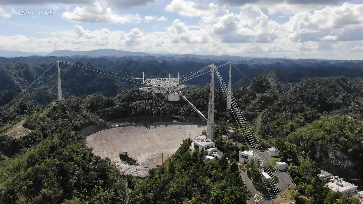 The Arecibo Observatory space telescope, which was damaged in August and in November from broken cables which tore holes in the structure, is seen in Arecibo, Puerto Rico November 7, 2020. Picture taken November 7, 2020. UCF/Handout via REUTERS. NO RESALES. NO ARCHIVES. THIS IMAGE HAS BEEN SUPPLIED BY A THIRD PARTY.