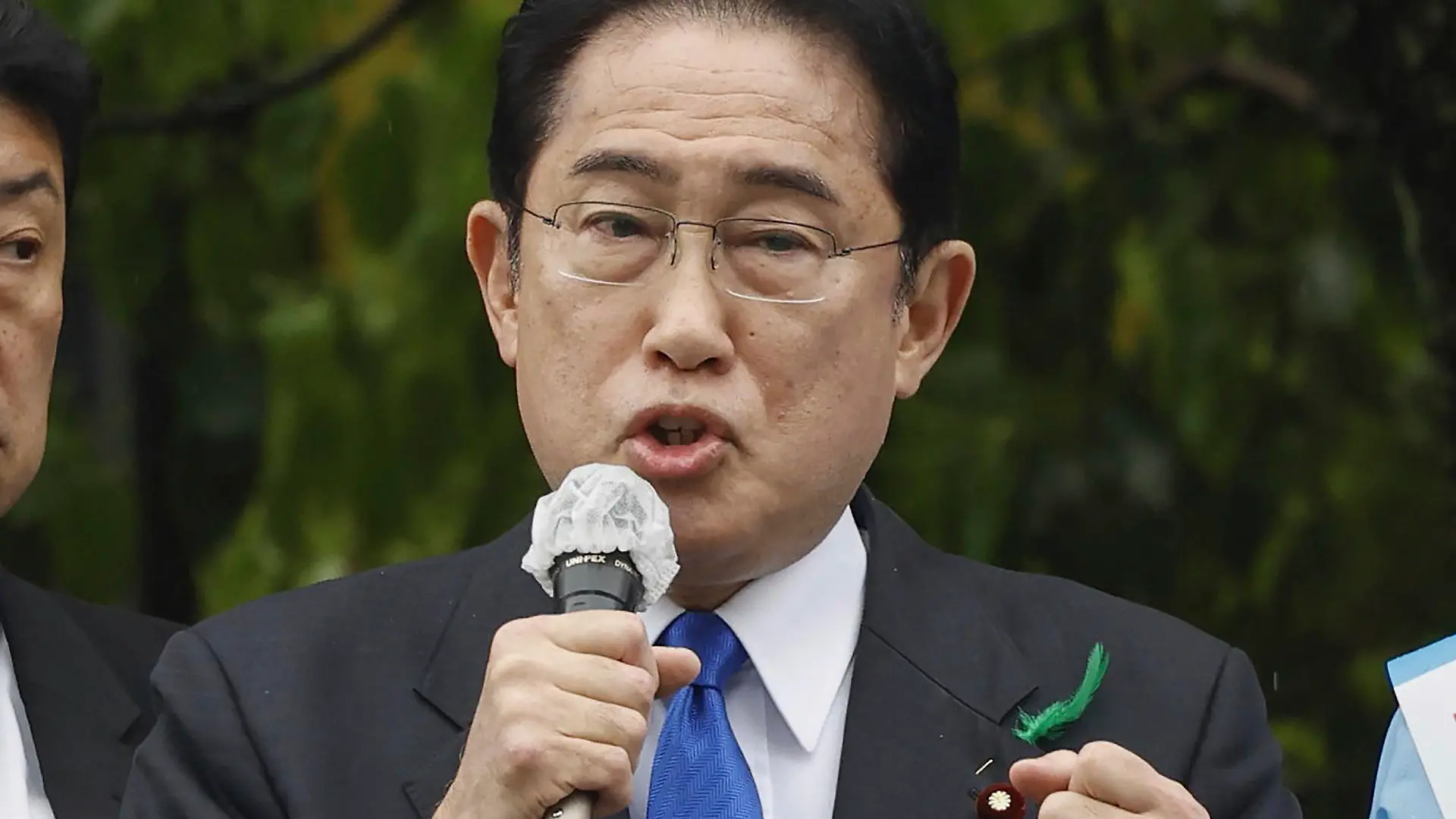 Japanese Prime Minister Fumio Kishida delivers a speech to support his ruling party’s candidate in a local election, near a train station in Wakayama, western Japan Saturday, April 15, 2023. Kishida was evacuated unharmed after an explosion at a western port on Saturday, NHK television reported, and a suspect was apprehended for allegedly throwing the explosive. (Kyodo News via AP)
