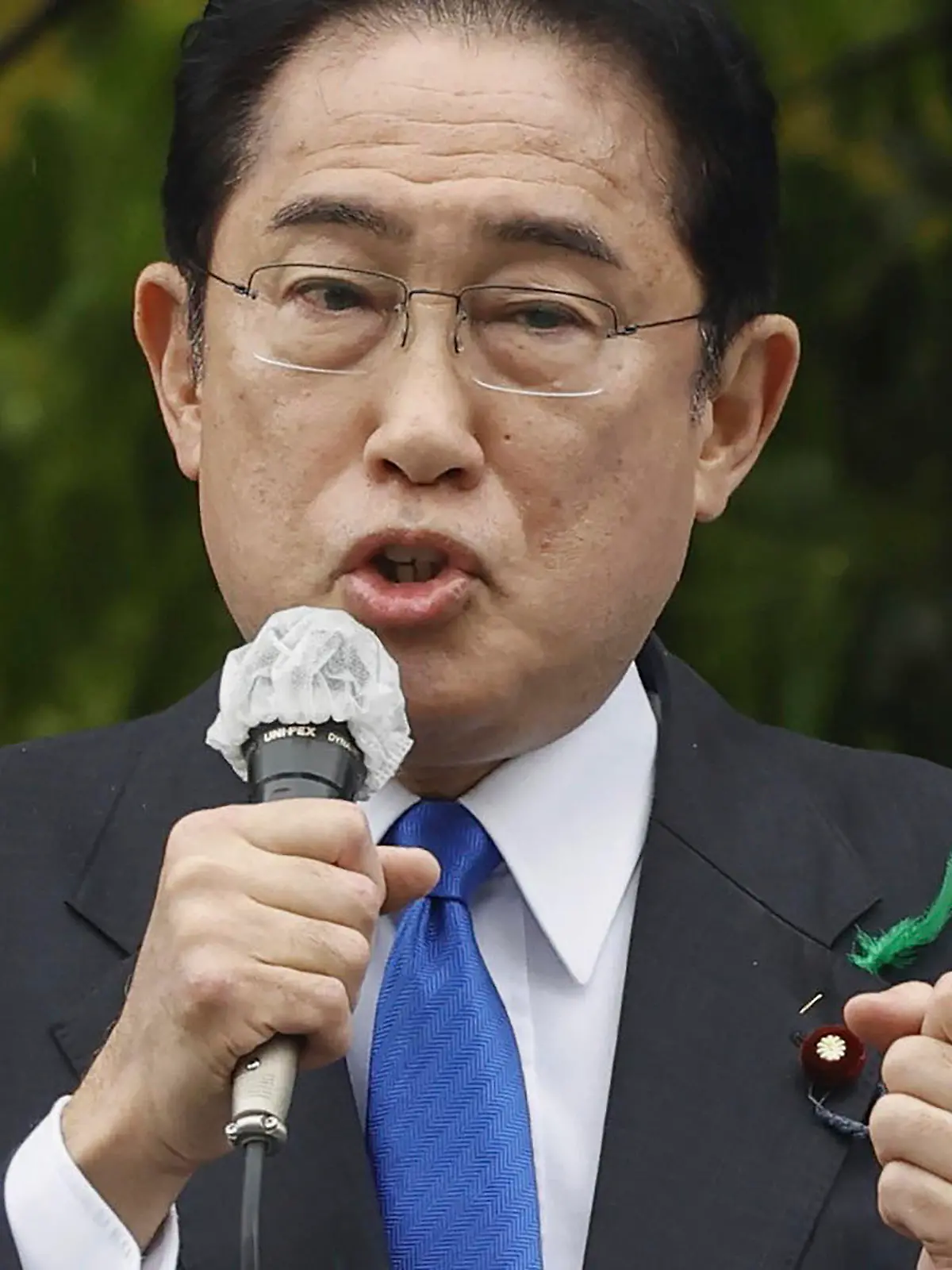 Japanese Prime Minister Fumio Kishida delivers a speech to support his ruling party’s candidate in a local election, near a train station in Wakayama, western Japan Saturday, April 15, 2023. Kishida was evacuated unharmed after an explosion at a western port on Saturday, NHK television reported, and a suspect was apprehended for allegedly throwing the explosive. (Kyodo News via AP)