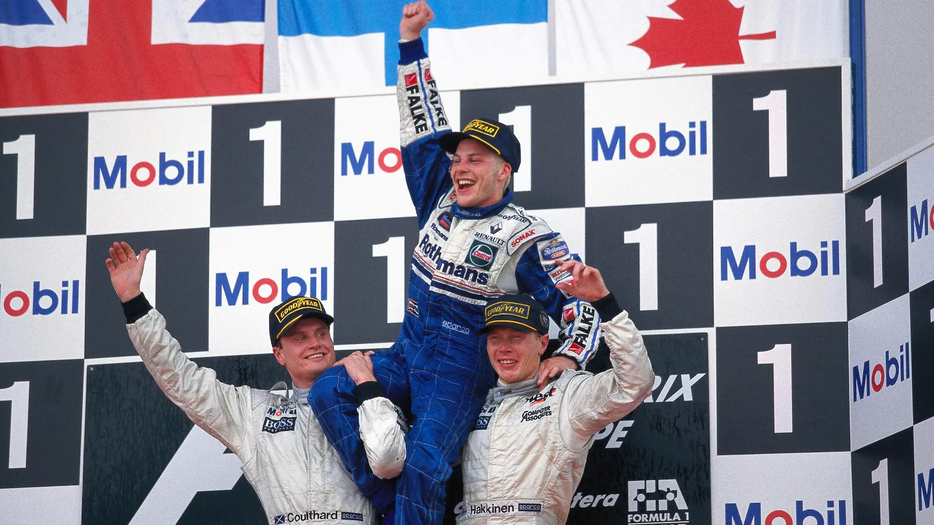 1997 European GP CIRCUITO DE JEREZ, SPAIN - OCTOBER 26: New World Champion Jacques Villeneuve celebrates on the shoulders of David Coulthard and Mika Hakkinen on the podium during the European GP at Circuito de Jerez on October 26, 1997 in Circuito de Jerez, Spain. PUBLICATIONxINxGERxSUIxAUTxHUNxONLY Copyright: xRainerxSchlegelmilchx 1015318692-SCH-19971026-97EU-G032-A3