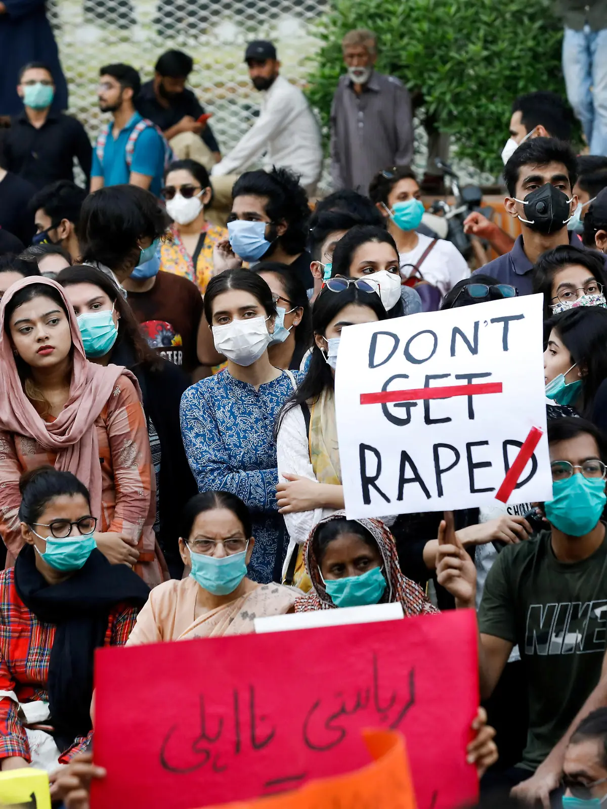 FILE PHOTO: People carry signs against a gang rape that occurred along a highway and to condemn violence against women and girls, during a protest in Karachi, Pakistan September 12, 2020. REUTERS/Akhtar Soomro/File Photo
