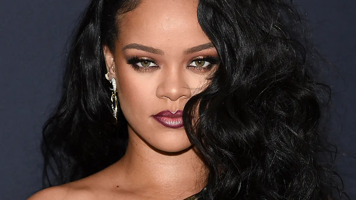FILE - Singer and fashion designer Rihanna attends the "Rihanna" book launch event in New York on Oct. 11, 2019. It's been four years since Rihanna released an album but the singer is working hard on recording new music. The pop star, 32, told The Associated Press for her new album she's already held “tons of writing camps" — where songwriters are put into groups to create original tracks for artists. (Photo by Evan Agostini/Invision/AP, File)