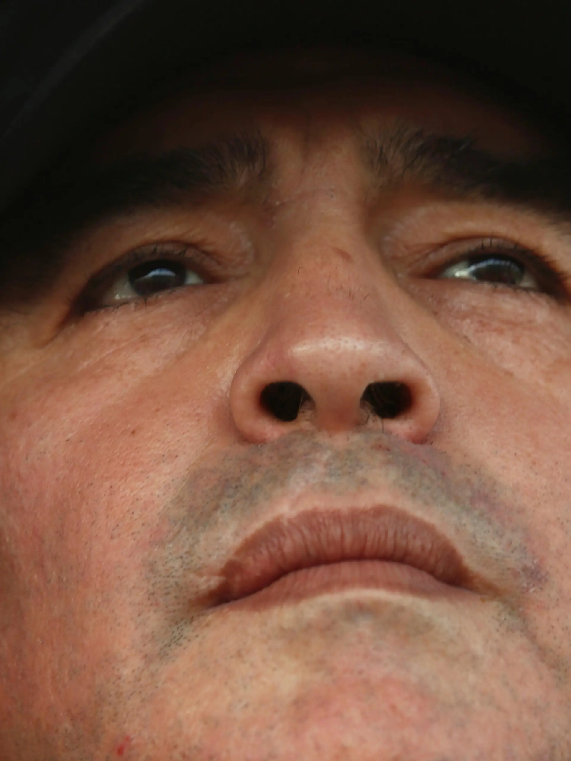 FILE PHOTO: Former Argentina captain and coach Diego Maradona watches the Primera D championship soccer match between Deportivo Riestra and San Miguel in Buenos Aires August 19, 2013. Maradona made his debut as a part-time consultant for Deportivo Riestra, an Argentine fifth-tier team. REUTERS/Marcos Brindicci/File Photo