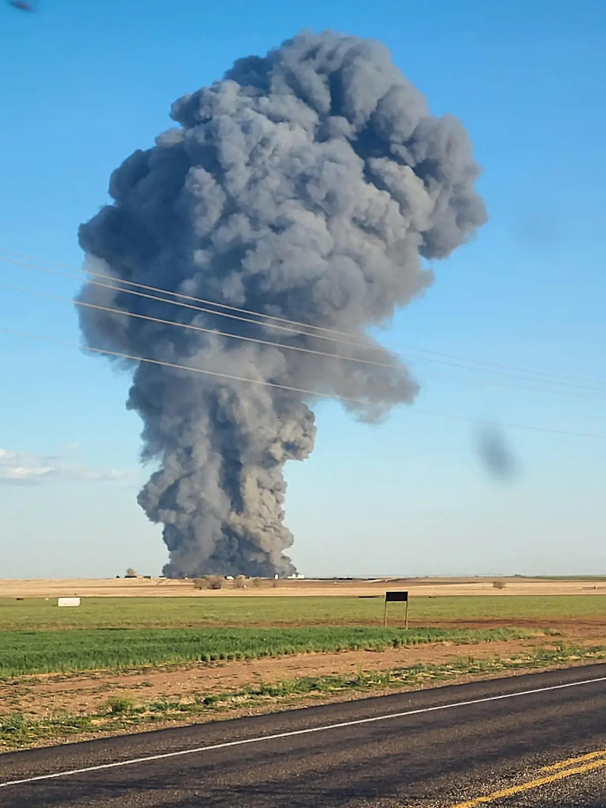 Smoke rises at the Southfork Dairy Farms, after an explosion and a fire killed around 18,000 cows, near Dimmitt, Texas, U.S., April 11, 2023, in this picture obtained from social media. Castro County Emergency Management/Local News X/TMX/via REUTERS  THIS IMAGE HAS BEEN SUPPLIED BY A THIRD PARTY. MANDATORY CREDIT. NO RESALES. NO ARCHIVES.