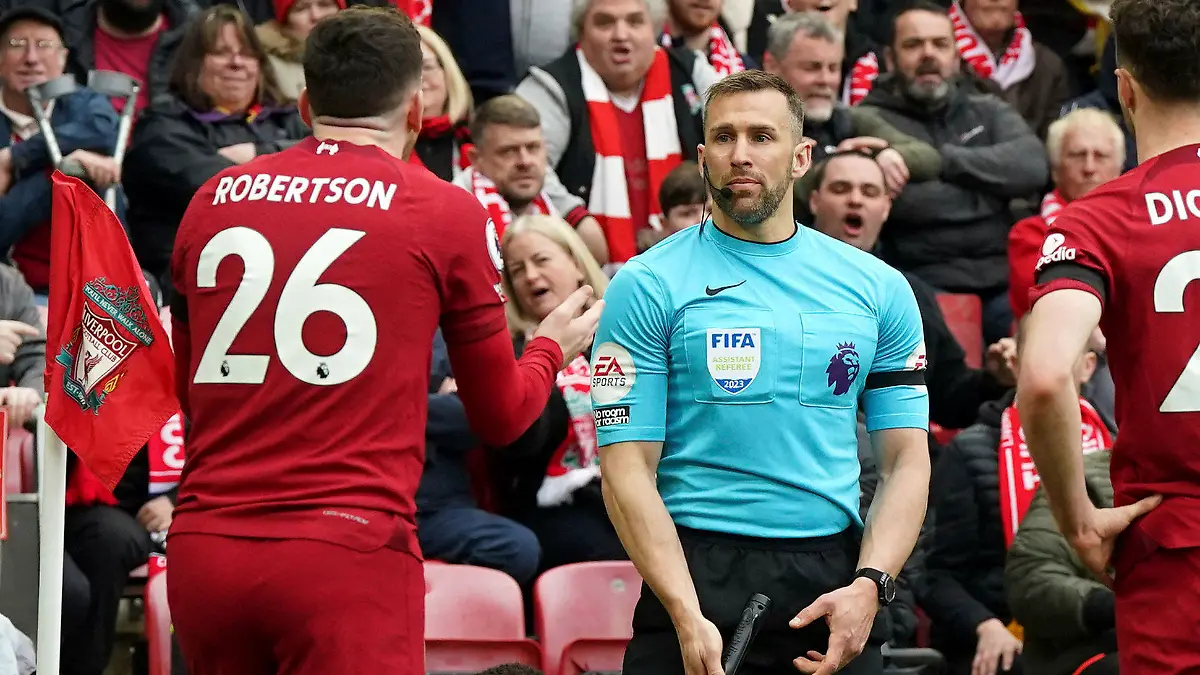 Liverpool's Andrew Robertson appeals to assistant referee Constantine Hatzidakis during the Premier League match between Liverpool and Arsenal at Anfield, Liverpool, Britain, Sunday April 9, 2023. (Nick Potts/PA via AP)