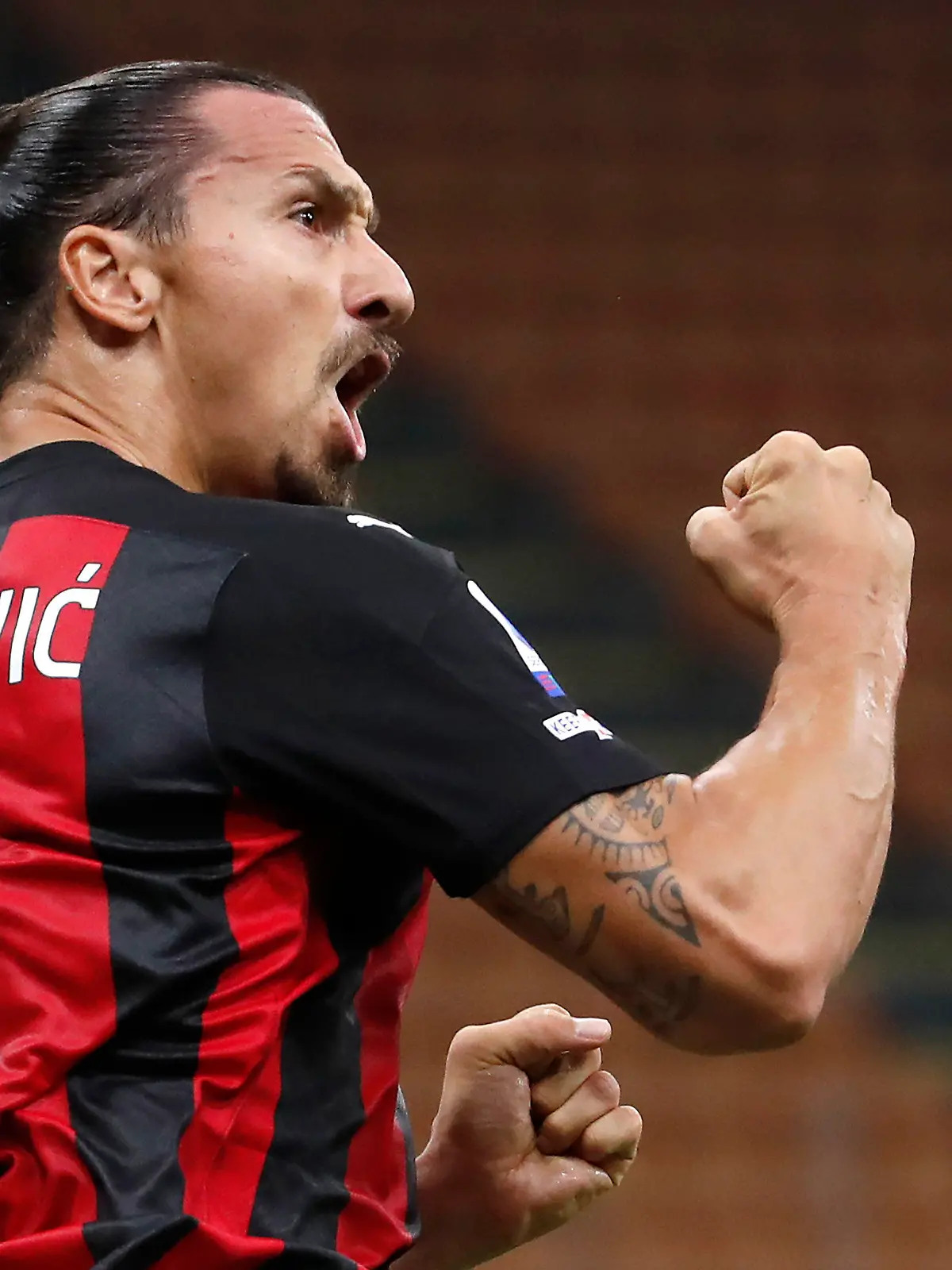 FILE - In this Sept. 21, 2020 file photo, AC Milan's Zlatan Ibrahimovic reacts during the Serie A soccer match between AC Milan and Bologna at the San Siro stadium, in Milan, Italy. It will be a strange atmosphere at San Siro when Inter Milan hosts city rival AC Milan on Saturday with only 1,000 fans allowed in because of the coronavirus pandemic. One player who is almost certain to be on the field is Milan forward Zlatan Ibrahimović, who returned to training this week after recovering from the virus. (AP Photo/Antonio Calanni)