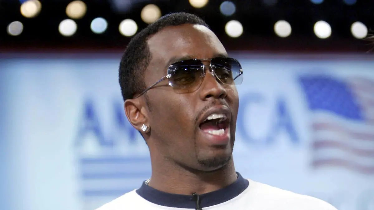 BOSTON - JULY 29: Hip-Hop star Sean "P-Diddy" Combs wears a "Vote or Die" T-Shirt during a television interview on the floor of the Democratic National Convention at the FleetCenter July 29, 2004 in Boston, Massachusetts. A number of celebrities have attended the convention, which closes later tonight when Senator John Kerry is expected to accept the nomination as the Democratic candidate for president. (Photo by Mario Tama/Getty Images)