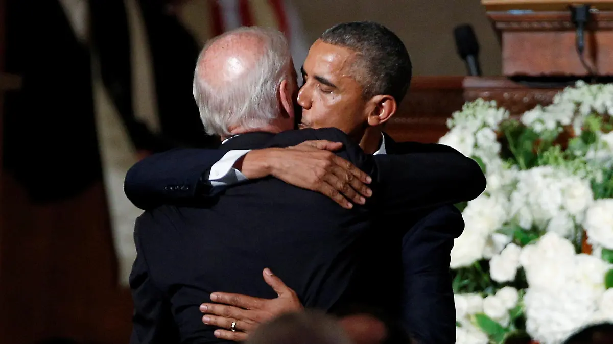 FILE PHOTO: U.S. President Barack Obama kisses Vice President Joe Biden on the cheek as he hugs him after delivering the eulogy during the funeral of Biden's son, former Delaware Attorney General Beau Biden, at St. Anthony of Padua church in Wilimington, Delaware, U.S., June 6, 2015. REUTERS/Kevin Lamarque/File Photo
