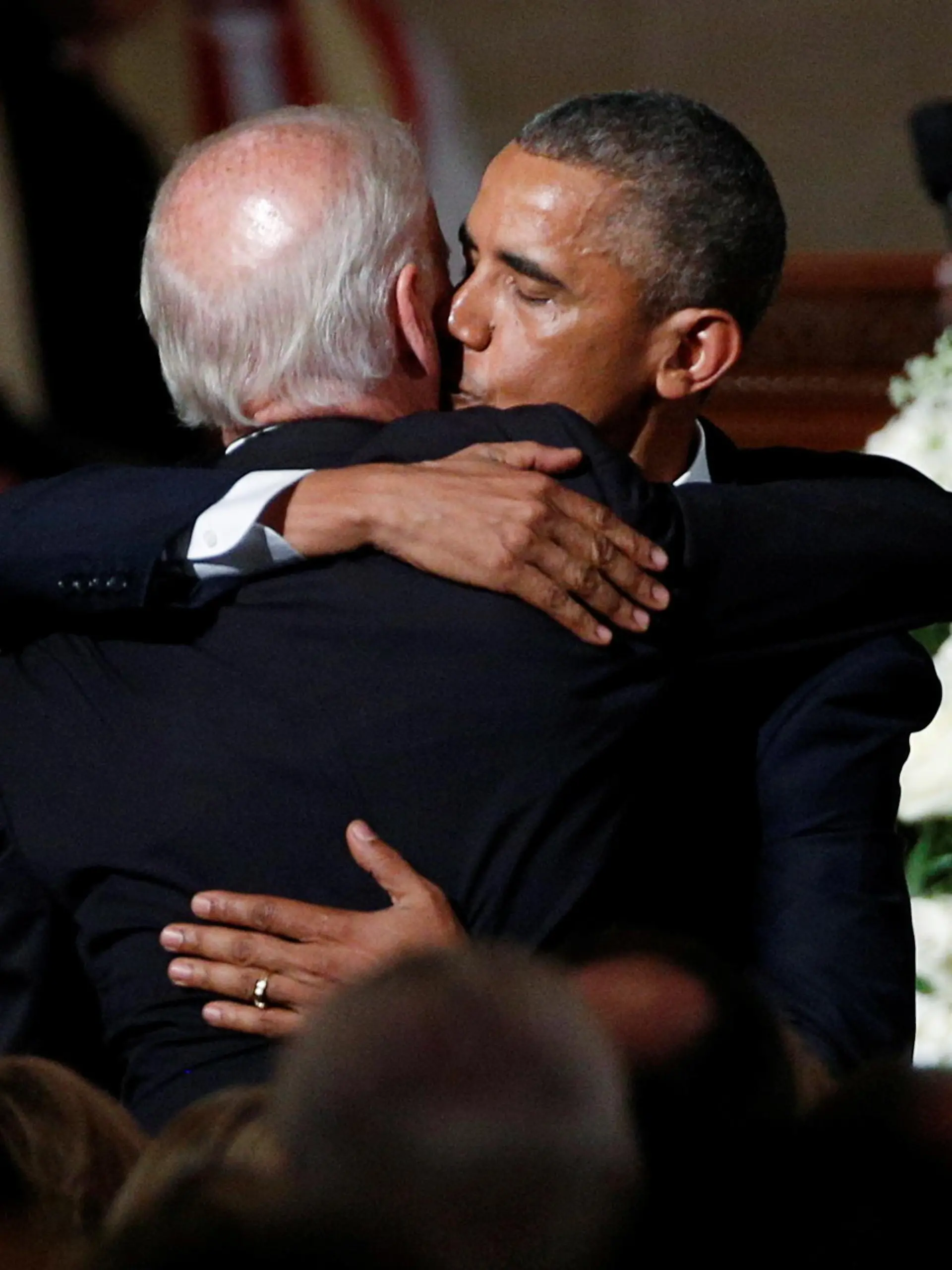FILE PHOTO: U.S. President Barack Obama kisses Vice President Joe Biden on the cheek as he hugs him after delivering the eulogy during the funeral of Biden's son, former Delaware Attorney General Beau Biden, at St. Anthony of Padua church in Wilimington, Delaware, U.S., June 6, 2015. REUTERS/Kevin Lamarque/File Photo