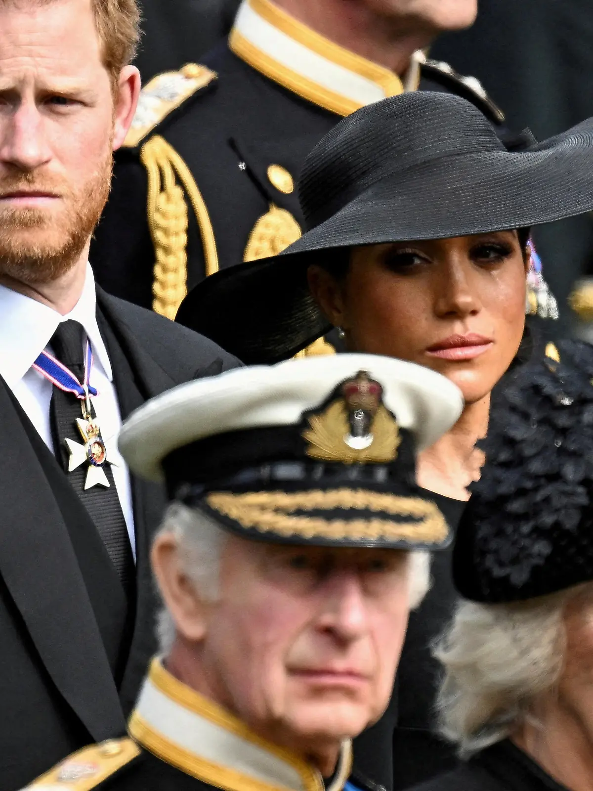 FILE PHOTO: Britain's Meghan, Duchess of Sussex, cries as she, Prince Harry, Duke of Sussex, Queen Camilla and King Charles attend the state funeral and burial of Britain's Queen Elizabeth, in London, Britain, September 19, 2022.       REUTERS/Toby Melville/File Photo