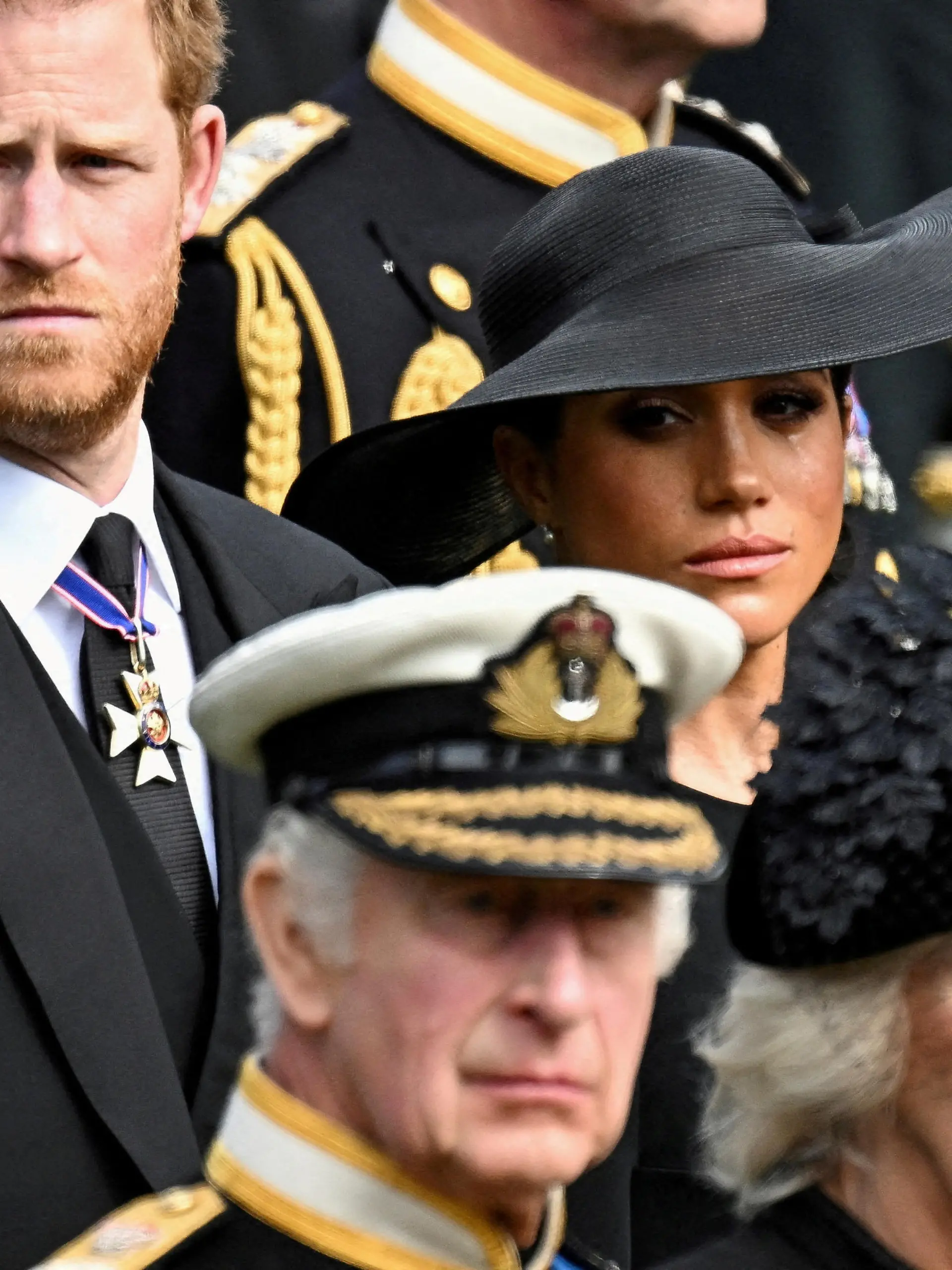 FILE PHOTO: Britain's Meghan, Duchess of Sussex, cries as she, Prince Harry, Duke of Sussex, Queen Camilla and King Charles attend the state funeral and burial of Britain's Queen Elizabeth, in London, Britain, September 19, 2022.       REUTERS/Toby Melville/File Photo