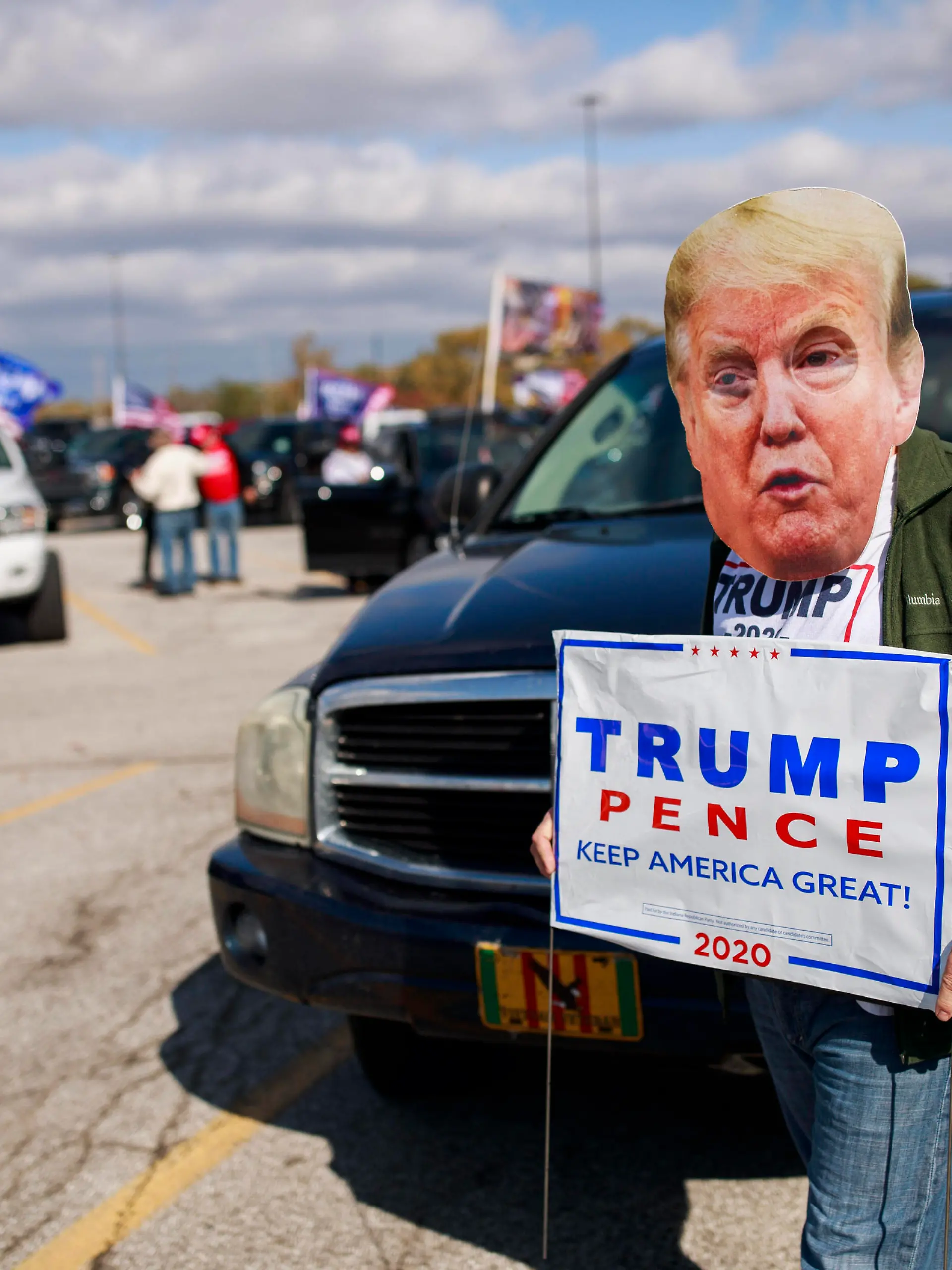 November 2, 2020, Indianapolis, Indiana, United States: Trump supporter wearing Trump mask seen during the parade. .Trump supporters gather in the Regal Greenwood & RPX movie theater parking lot to leave for a Trump parade caravan around Interstate 465 two days before the 2020 election. United States President Donald J. Trump is running for reelection against Democrat Joe Biden. Indianapolis United States - ZUMAs197 20201102_zaa_s197_006 Copyright: xJeremyxHoganx