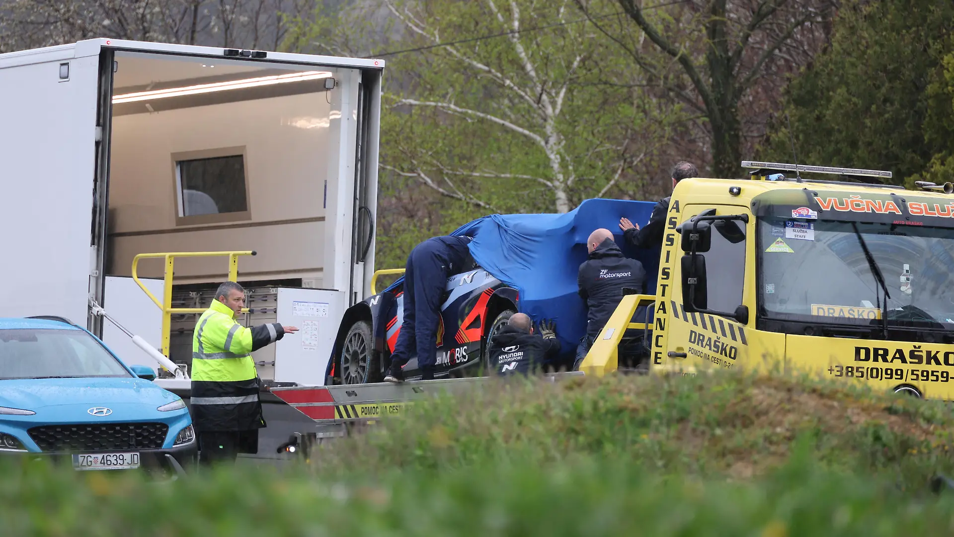 Employees from Hyundai Motorsport inspect the car in which Ireland's top rally driver Craig Breen was killed, near the village of Stari Golubovec, Croatia, April 13, 2023. REUTERS/Antonio Bronic