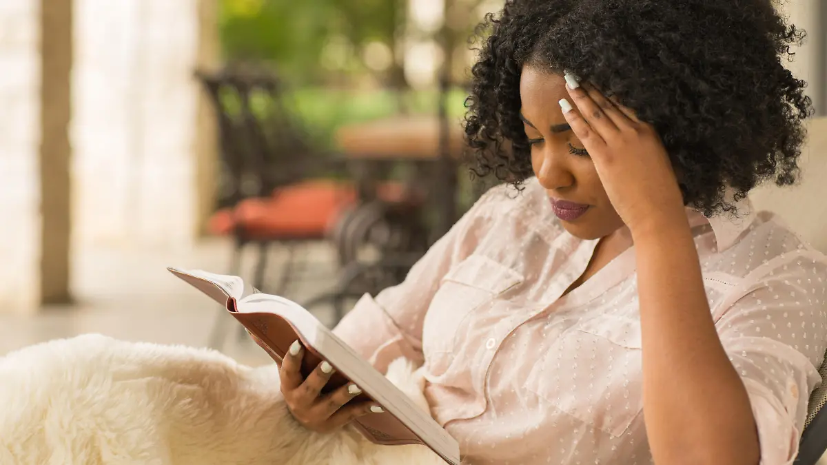 African American woman reading.
