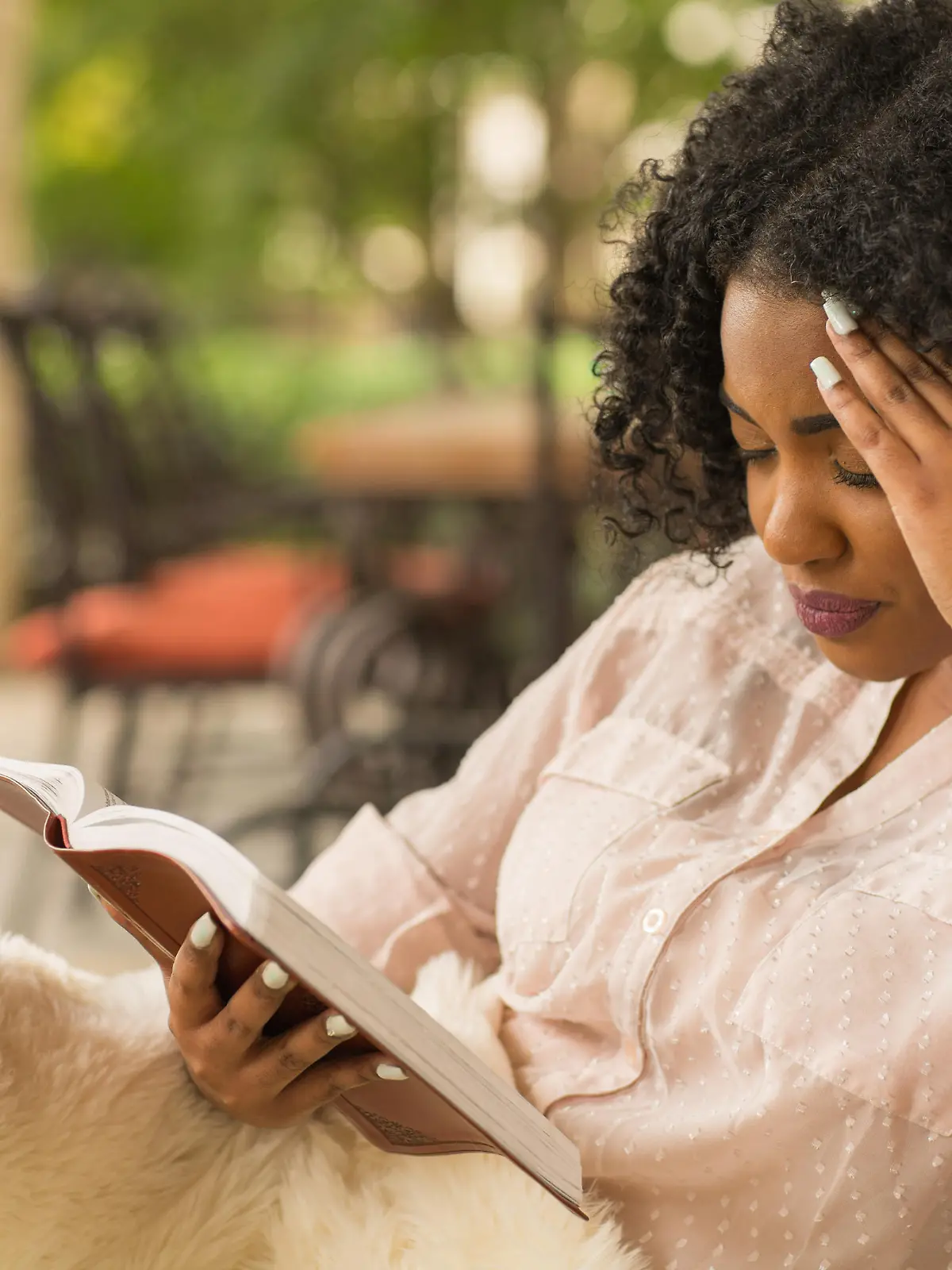 African American woman reading.