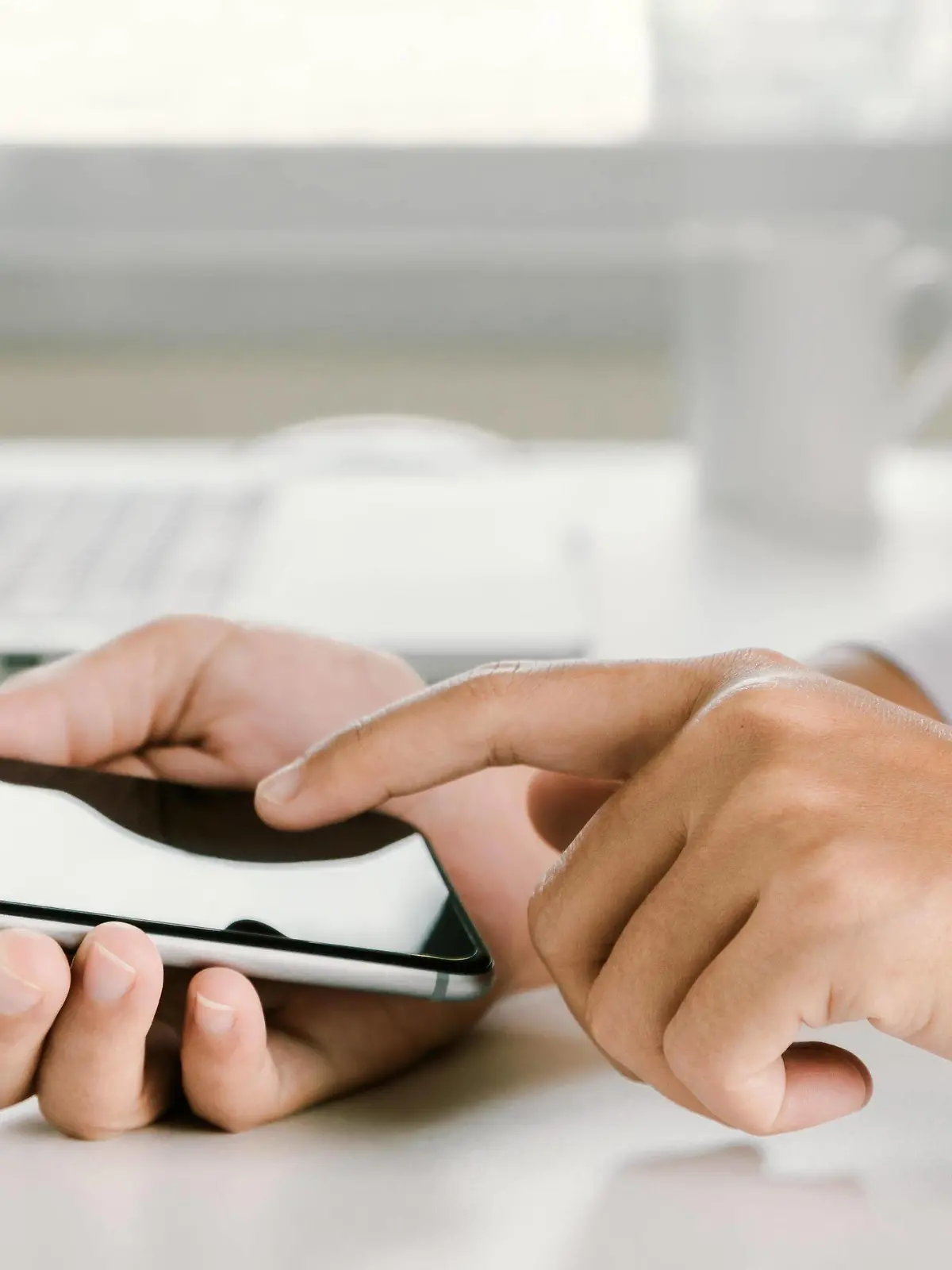 closeup woman hand using phone on workspace in office PUBLICATIONxINxGERxSUIxAUTxONLY Copyright: xblackzheepx Panthermedia19131903  