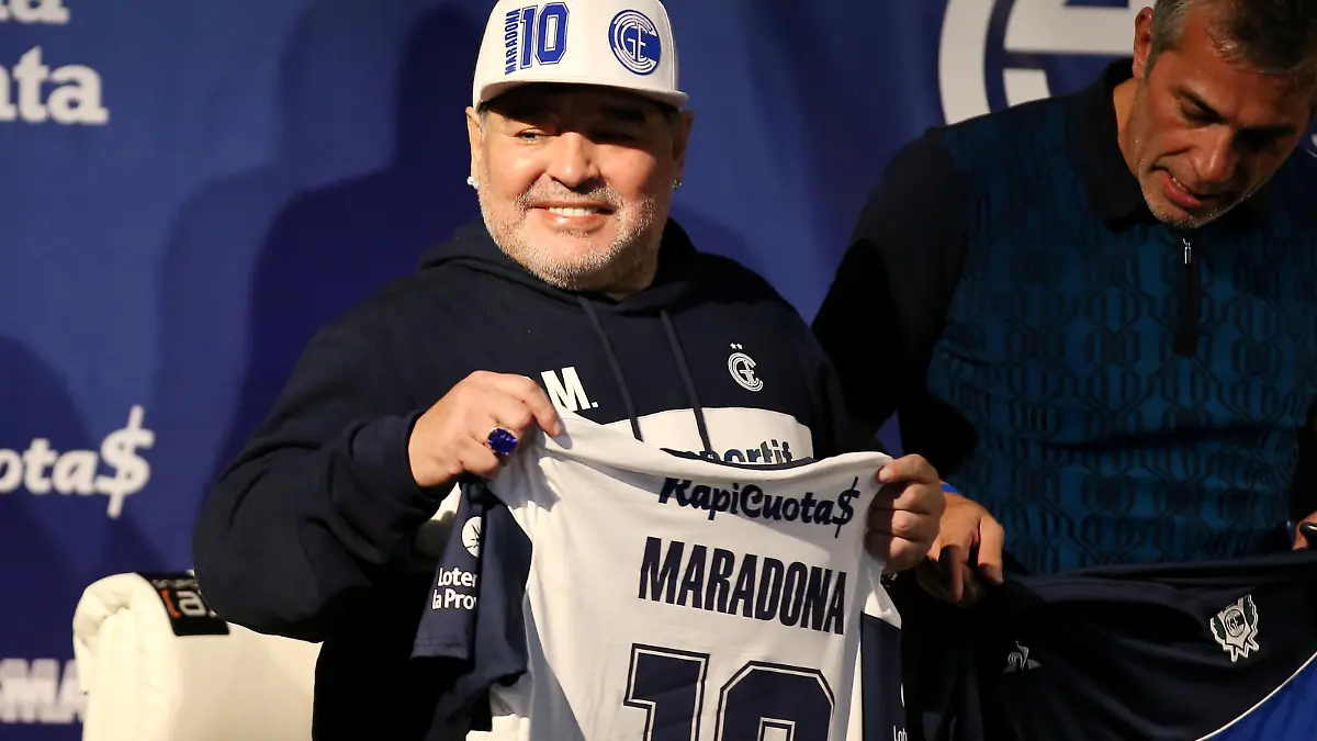 FILE PHOTO: Soccer Football - Argentina - La Plata, Argentina - September 8, 2019 President of Gimnasia y Esgrima Gabriel Pellegrino and Diego Maradona during his presentation as new coach REUTERS/Agustin Marcarian/File Photo