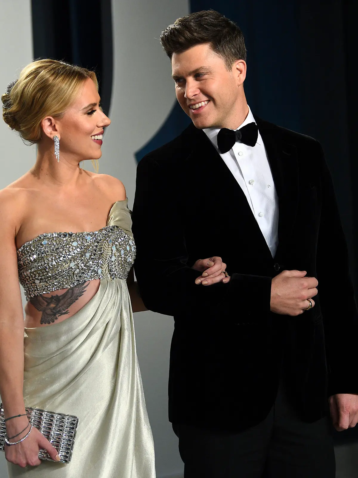 FILE - In this Feb. 9, 2020 file photo, Scarlett Johansson, left, and Colin Jost arrive at the Vanity Fair Oscar Party in Beverly Hills, Calif.  Meals on Wheels America announced Thursday on Instagram that Johansson and Jost married over the weekend in an intimate ceremony. (Photo by Evan Agostini/Invision/AP, FIle)