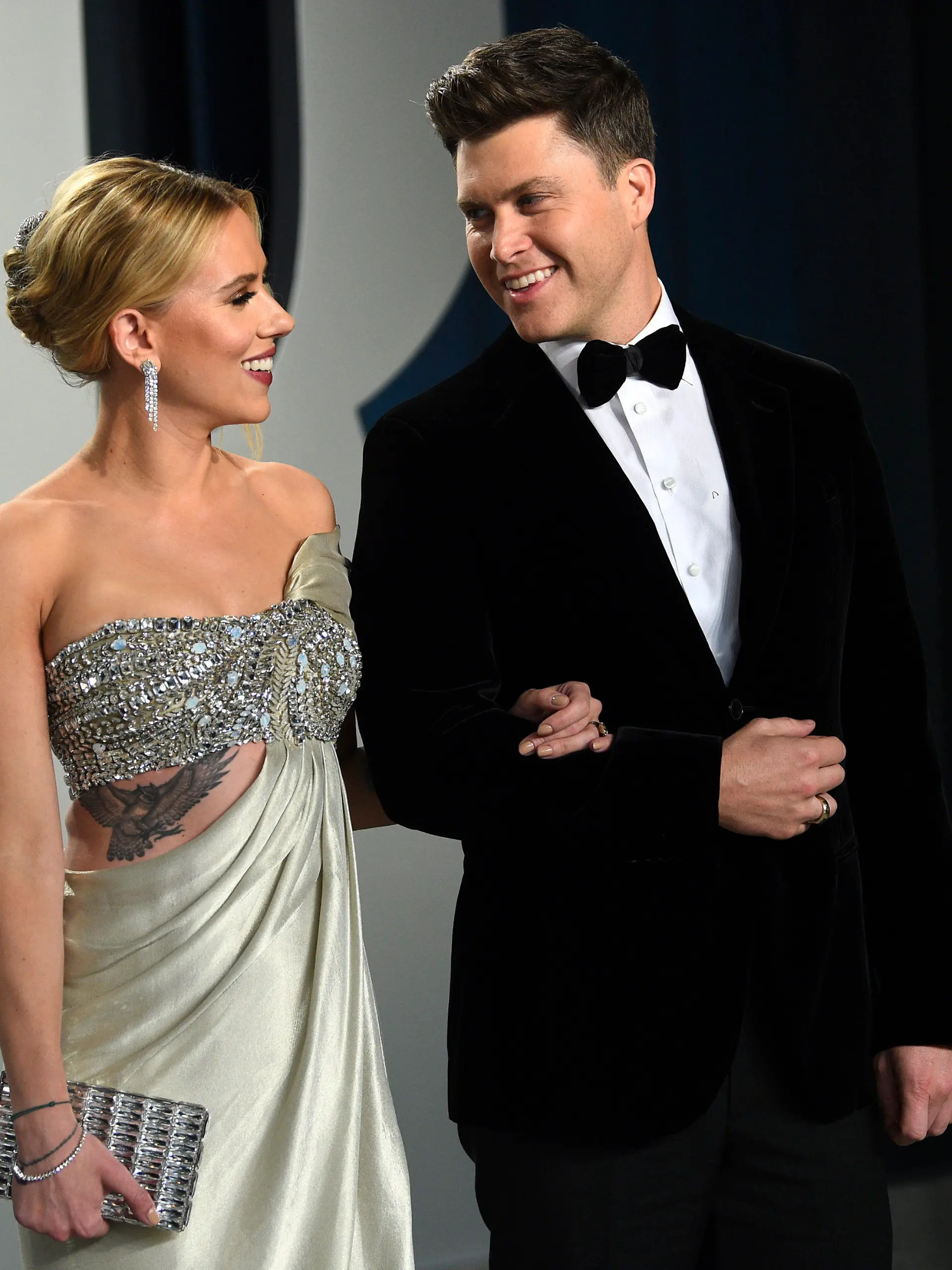 FILE - In this Feb. 9, 2020 file photo, Scarlett Johansson, left, and Colin Jost arrive at the Vanity Fair Oscar Party in Beverly Hills, Calif.  Meals on Wheels America announced Thursday on Instagram that Johansson and Jost married over the weekend in an intimate ceremony. (Photo by Evan Agostini/Invision/AP, FIle)