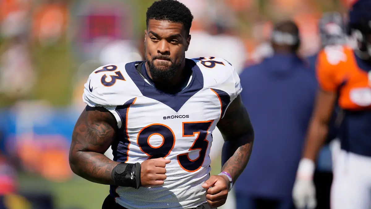 Denver Broncos defensive end Dre'Mont Jones takes part in drills during the NFL football team's training camp Tuesday, Aug. 2, 2022, at the Broncos' headquarters in Centennial, Colo. (AP Photo/David Zalubowski)