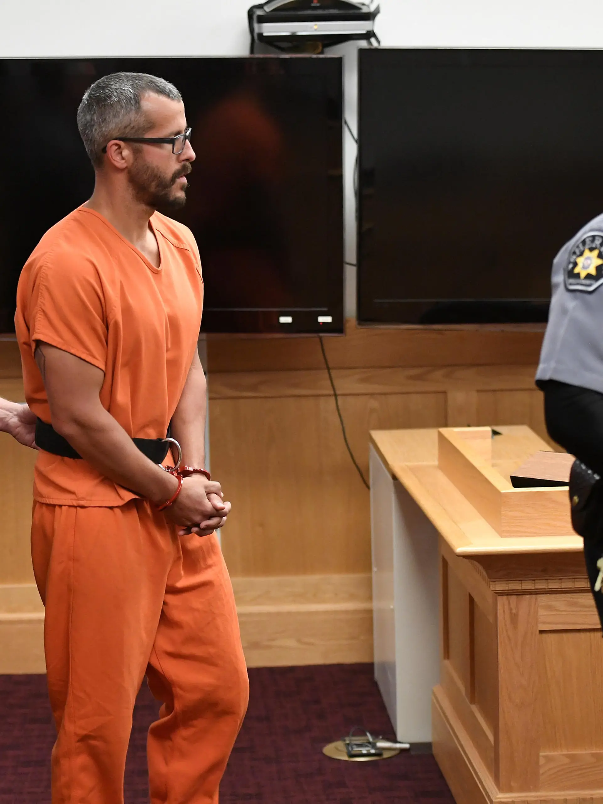 FILE PHOTO: Christopher Watts, facing nine charges including several counts of first-degree murder of his wife and his two young daughters, appears in court for his arraignment hearing at the Weld County Courthouse in Greeley, Colorado, U.S. August 21, 2018.    RJ Sangosti/Pool via REUTERS/File Photo