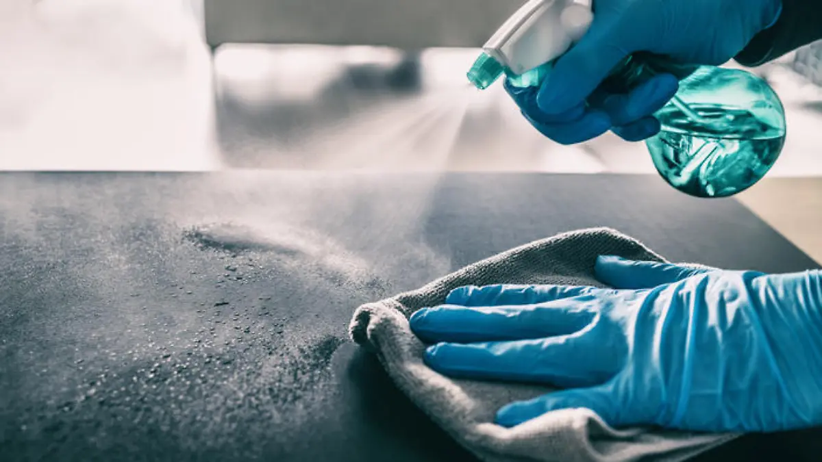 Surface sanitizing against COVID-19 outbreak. Home cleaning spraying antibacterial spray bottle disinfecting against coronavirus wearing nitrile gloves. Sanitize hospital surfaces prevention. (Surface sanitizing against COVID-19 outbreak. Home cleani