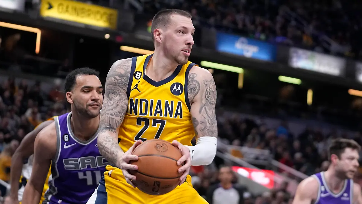 Indiana Pacers' Daniel Theis grabs a rebound during the first half of an NBA basketball game against the Sacramento Kings, Friday, Feb. 3, 2023, in Indianapolis. (AP Photo/Darron Cummings)