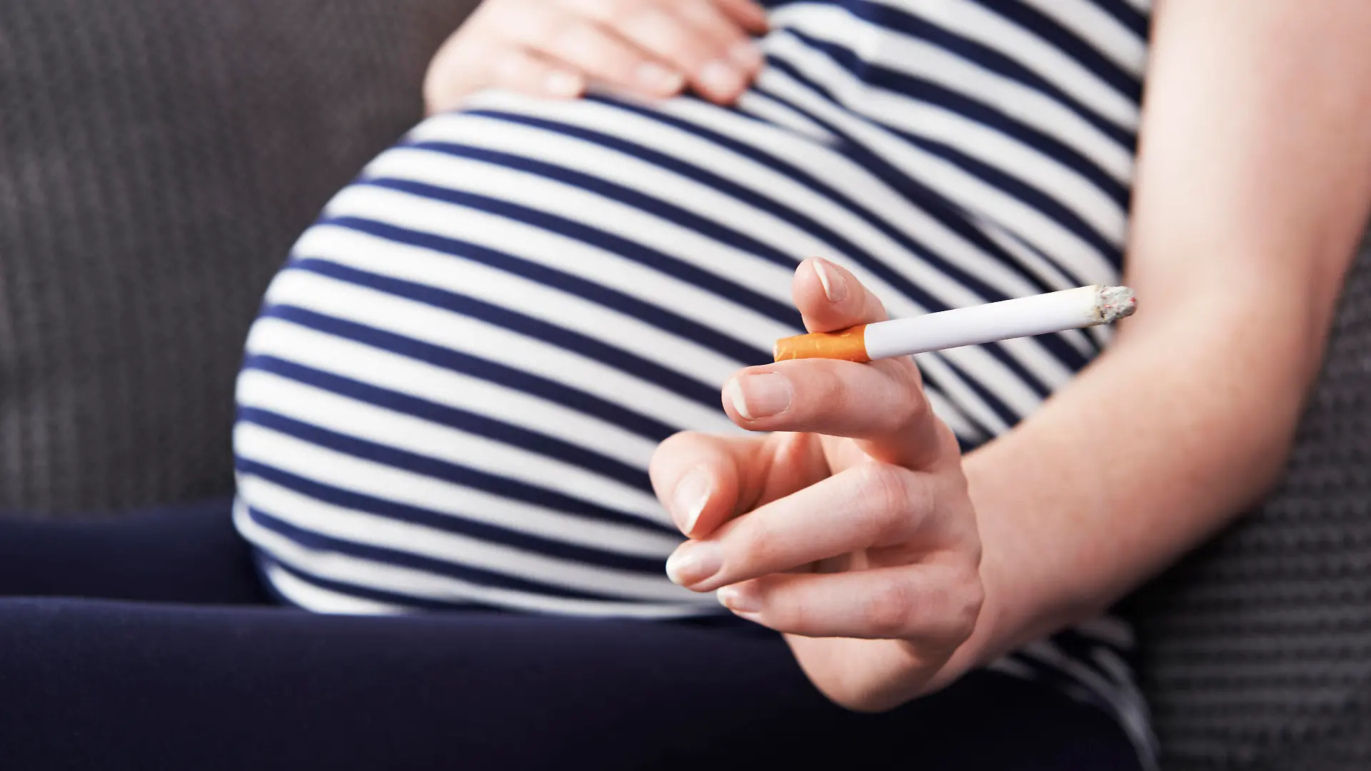 Close Up Of Pregnant Woman Smoking Cigarette