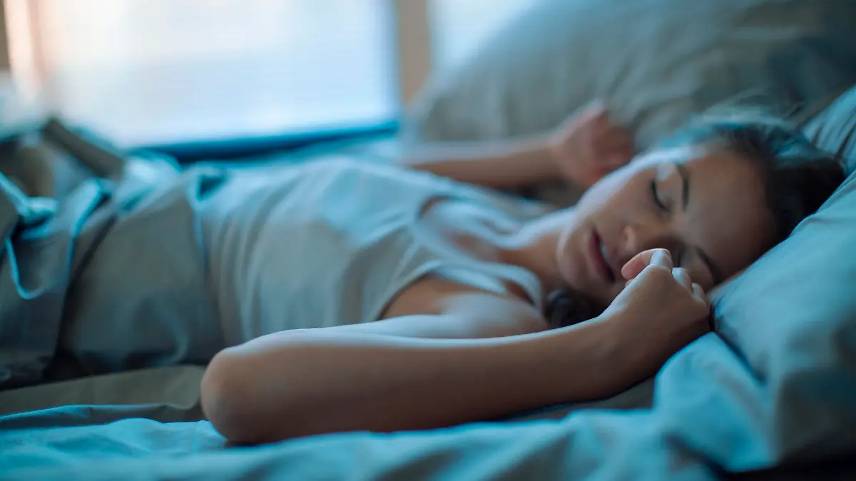 Close up of a woman sleeping on the bed