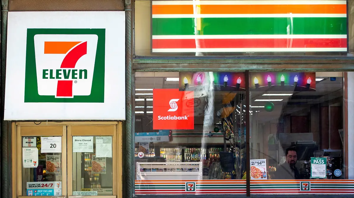 FILE PHOTO: A 7-Eleven storefront in Toronto, Ontario, Canada December 13, 2021.  REUTERS/Carlos Osorio/File Photo