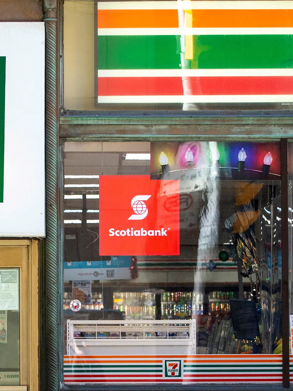 FILE PHOTO: A 7-Eleven storefront in Toronto, Ontario, Canada December 13, 2021.  REUTERS/Carlos Osorio/File Photo