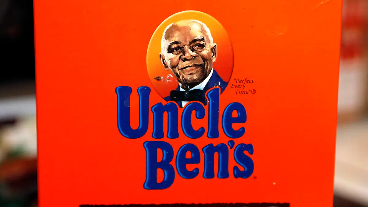 The portrait of "Uncle Ben's" is portrayed on a box of rice Thursday, June 18, 2020 in Jackson, Miss. The Uncle Ben's rice brand is getting a new name: Ben's Original. Parent firm Mars Inc. unveiled the change Wednesday, Sept. 23, 2020 for the 70-year-old brand, the latest company to drop a logo criticized as a racial stereotype. Packaging with the new name will hit stores next year. (AP Photo/Rogelio V. Solis)