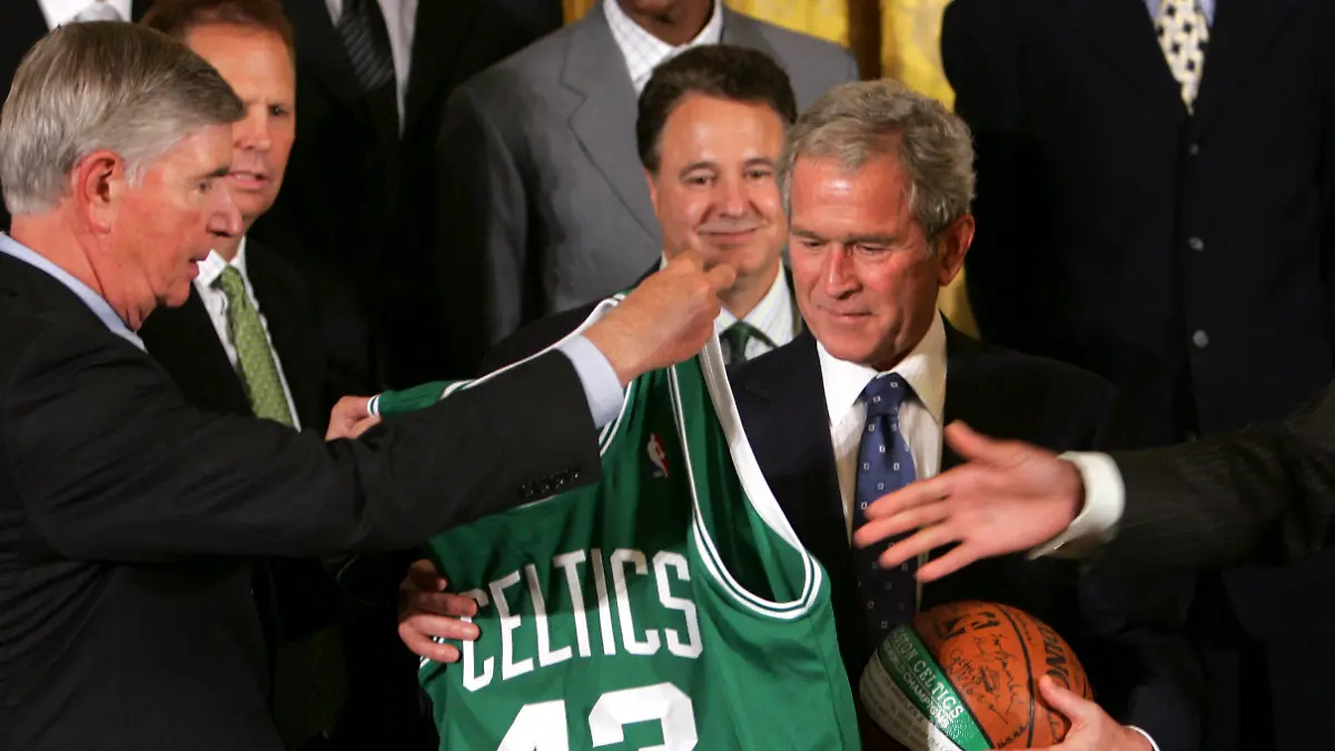 President Bush receives a Boston Celtics jersey and basketball given to him by 2008 NBA Champions Boston Celtics co-owner, H. Irving Grousbeck, left, and team captain Paul Pierce, Friday, Sept. 19, 2008, while hosting the team in the East Room of the White House in Washington, Friday, Sept. 19, 2008. (AP Photo/Lawrence Jackson)