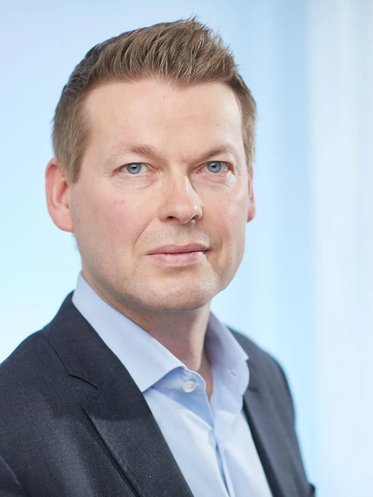 Marco Ciomperlik guckt in die Kamera. Der Deutsche ist Chef aller Ferienfluggesellschaften bei Tui.