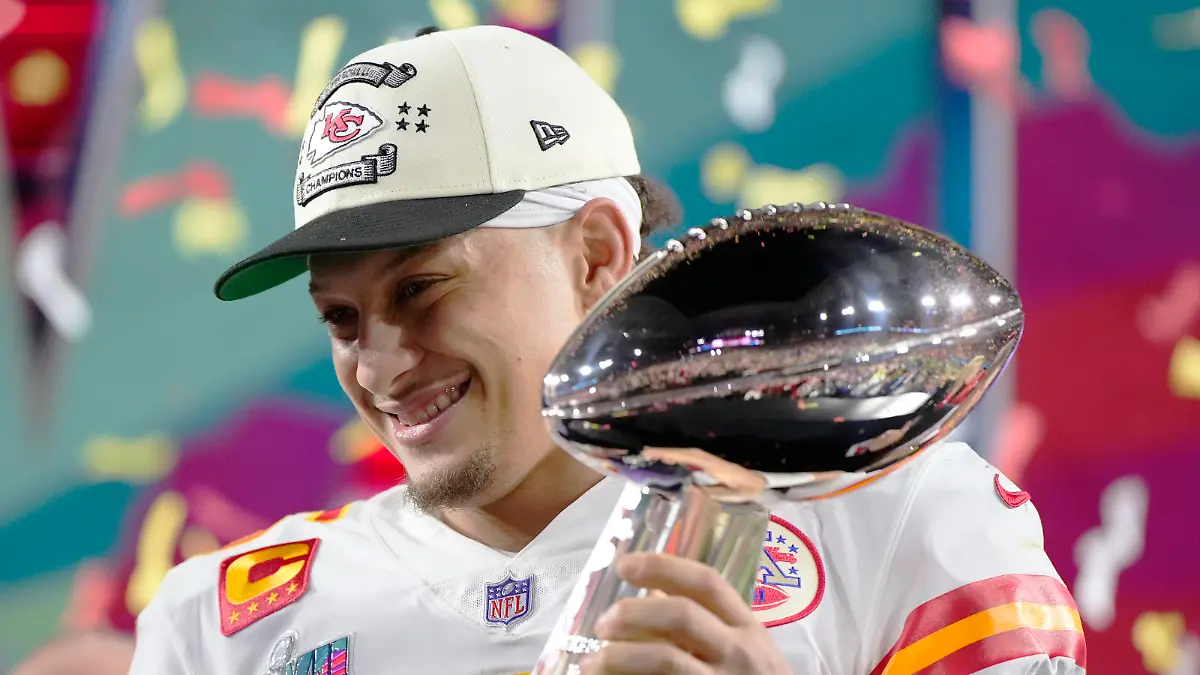 Kansas City Chiefs quarterback Patrick Mahomes (15) holds the trophy after their win against the Philadelphia Eagles in the NFL Super Bowl 57 football game, Sunday, Feb. 12, 2023, in Glendale, Ariz. The Kansas City Chiefs defeated the Philadelphia Eagles 38-35. (AP Photo/Matt Slocum)