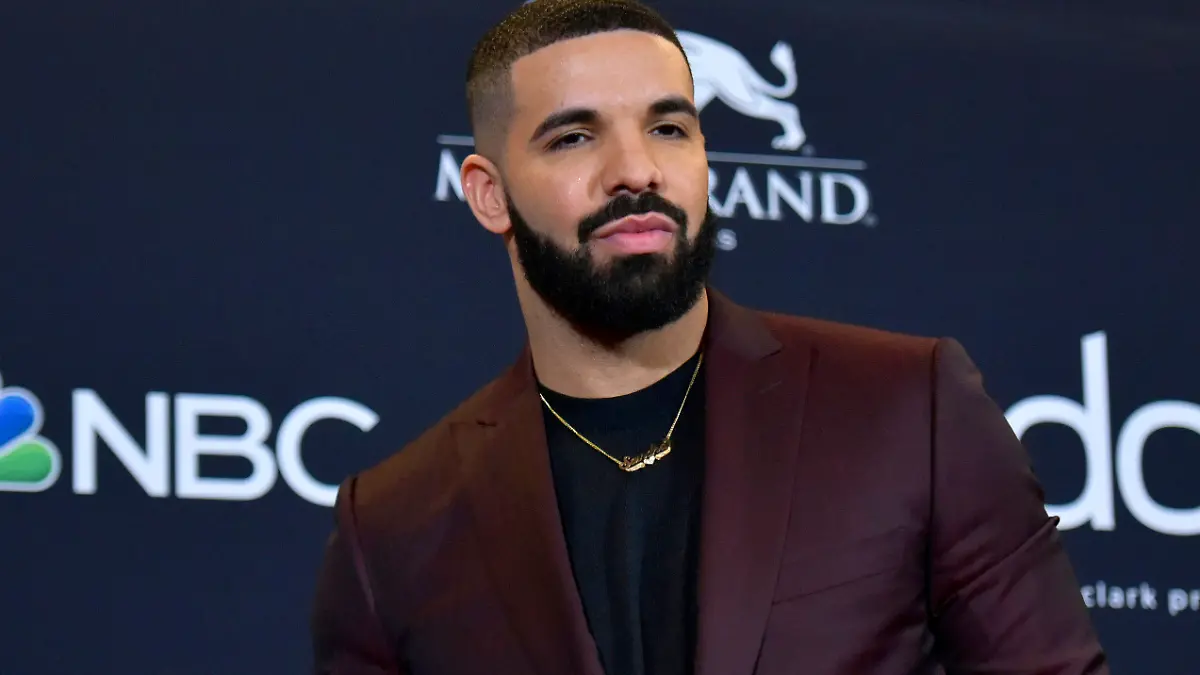 FILE - This May 1, 2019 file photo shows Drake at the Billboard Music Awards in Las Vegas. Earning his 21st No. 1 hit on Billboard's R&B/Hip-Hop songs chart, Drake has bested a record previously held by icons Aretha Franklin and Stevie Wonder. Drake's “Laugh Now Cry Later," featuring rapper Lil Durk, reached the No. 1 spot on the chart this week. Wonder and Franklin, who died in 2018, each have had 20 songs top the chart. (Photo by Richard Shotwell/Invision/AP, File)